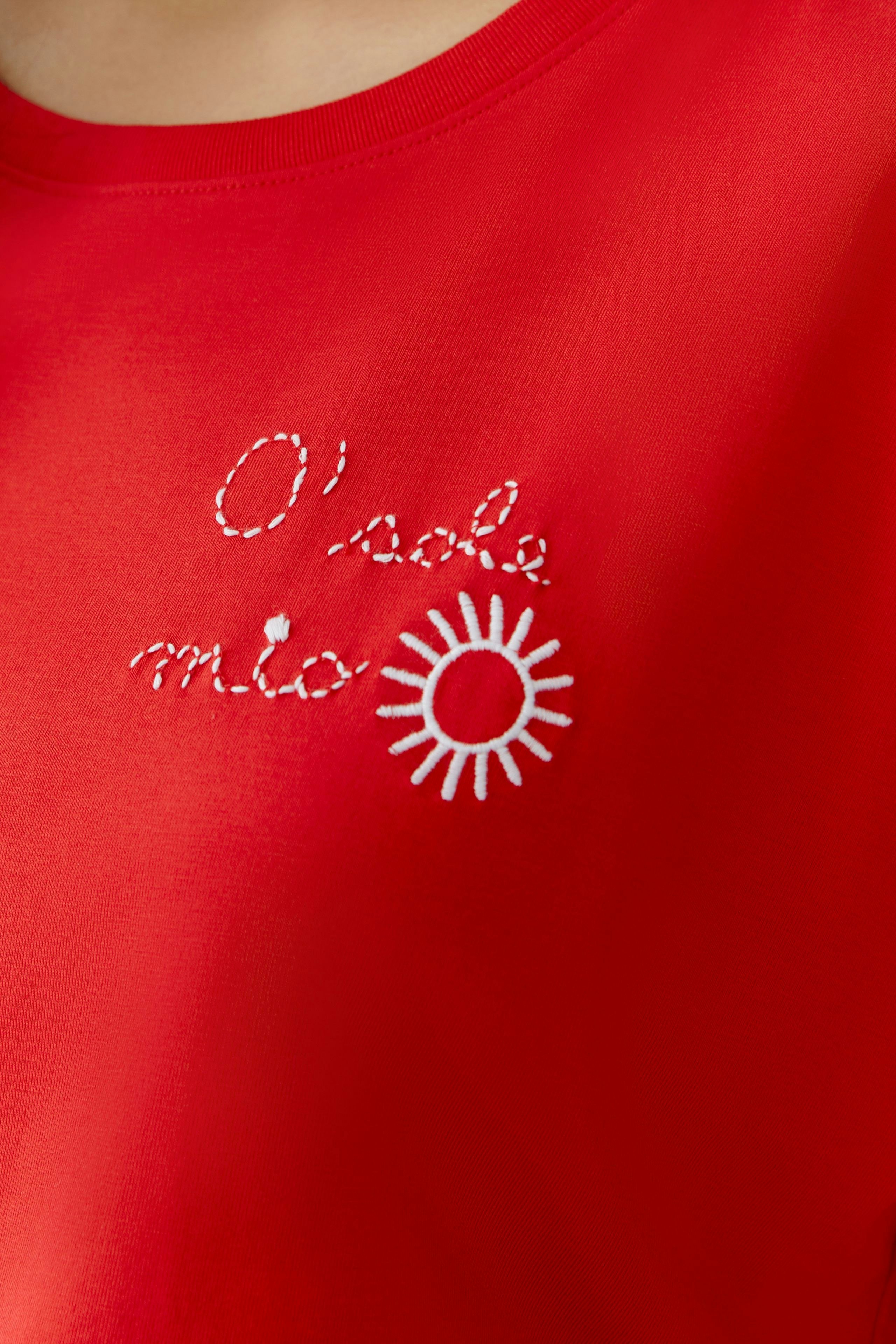 Casual women's T-shirt in red with white embroidery, featuring a sun design and playful text.