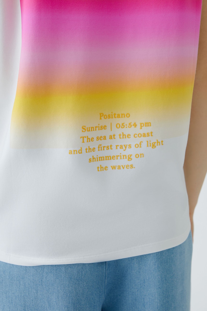 Colorful women's T-shirt with a gradient design, featuring a beach-inspired print.