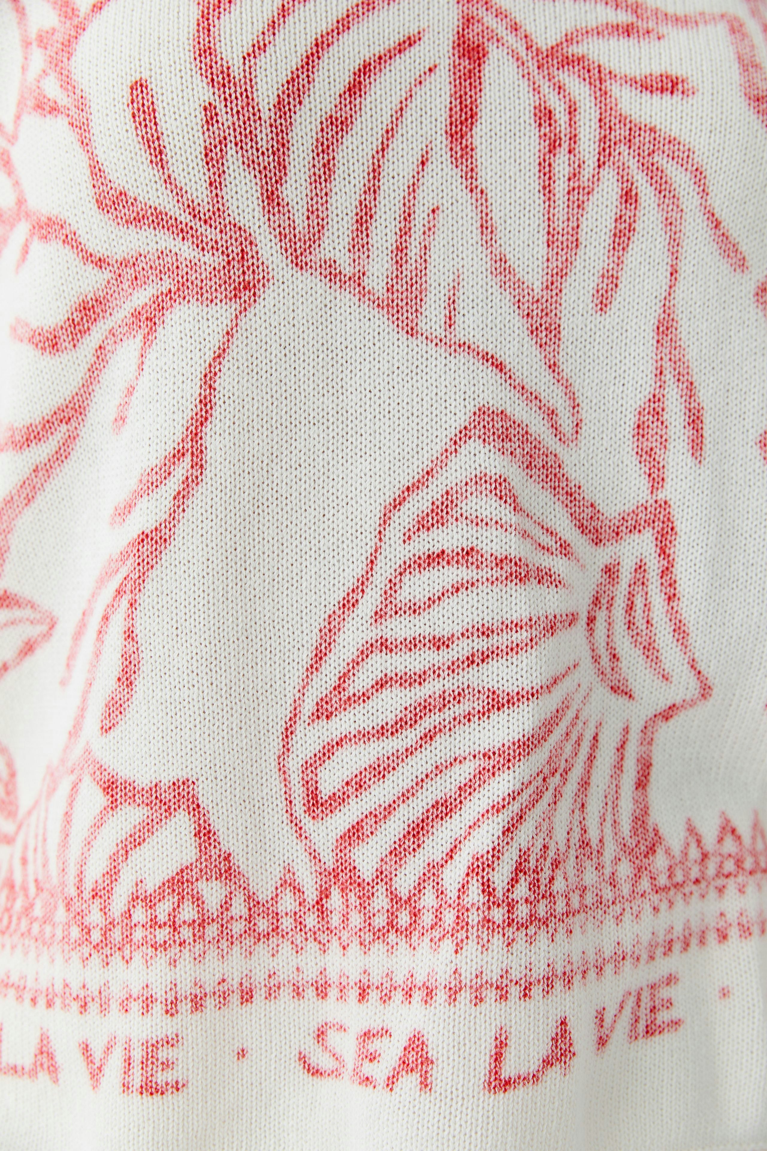 Damen-Pullover mit maritimem Muster in Rot und Weiß, ideal für lässige Outfits.