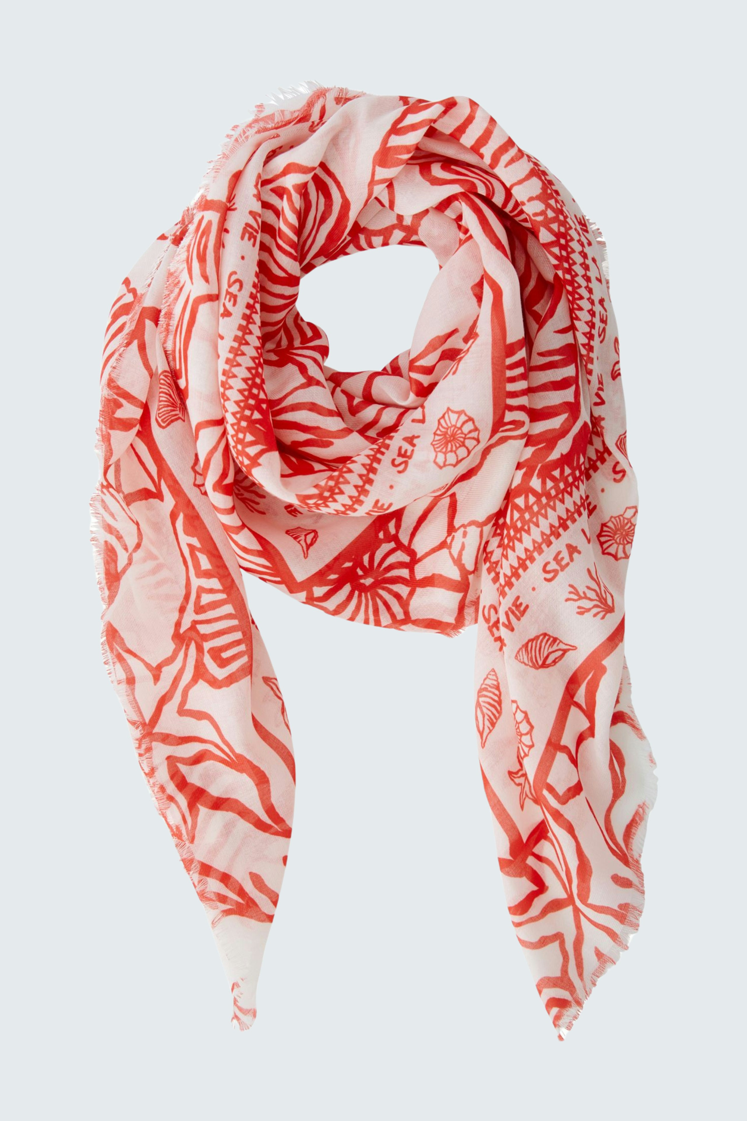 Helles Damen-Tuch mit buntem Muster, lässig um den Hals drapiert.