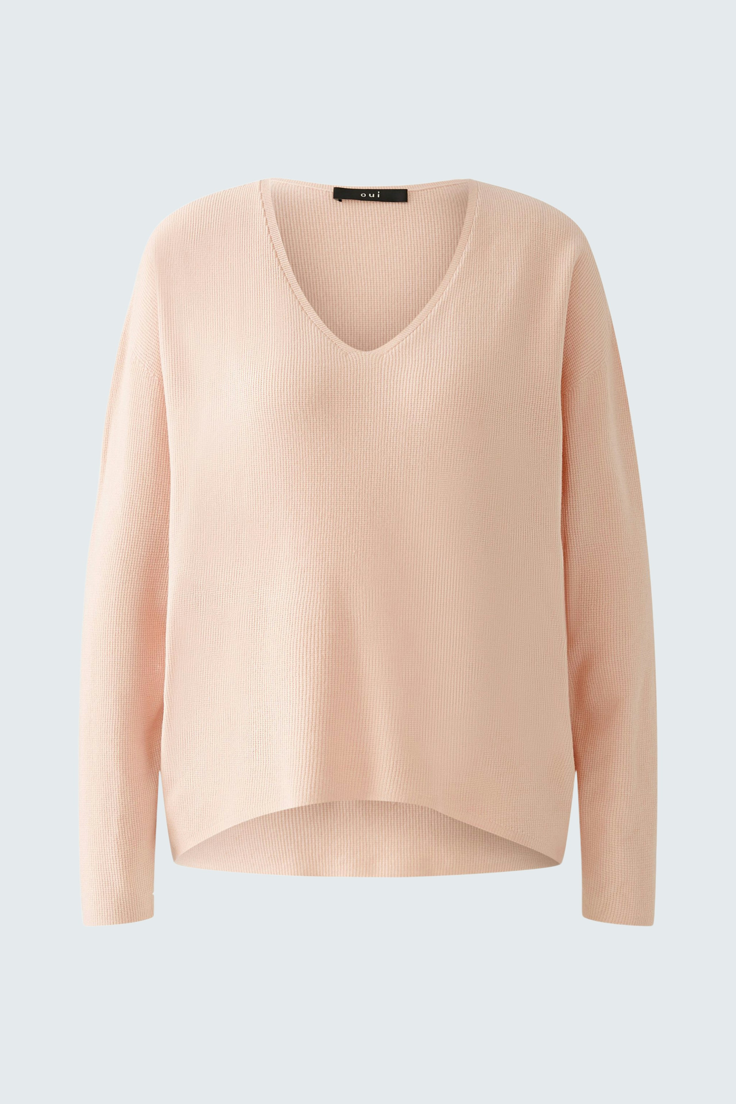 Soft pink pullover with a V-neck, perfect for casual and stylish looks.