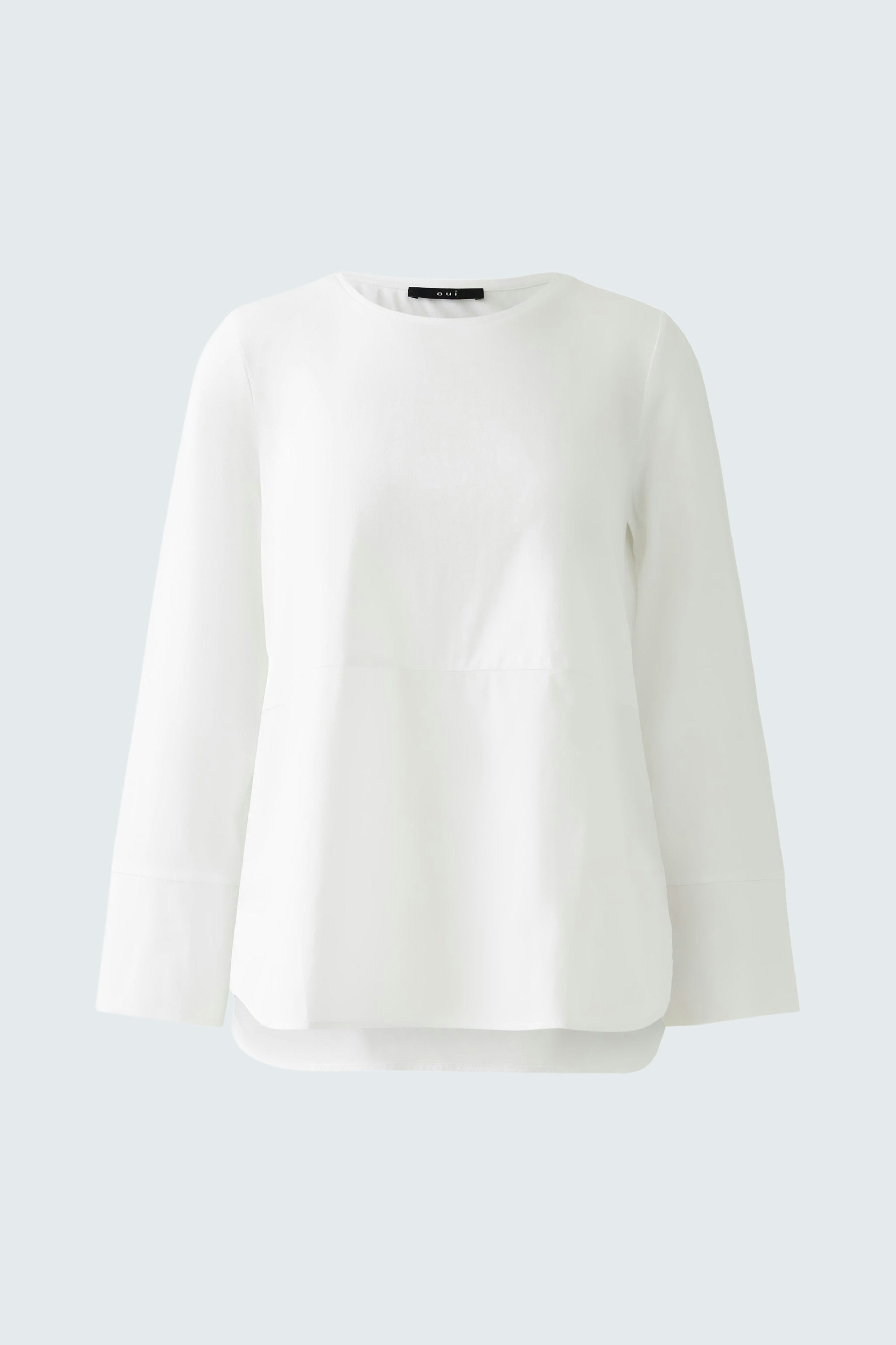 Elegant women's blouse shirt in white with a relaxed fit and long sleeves.