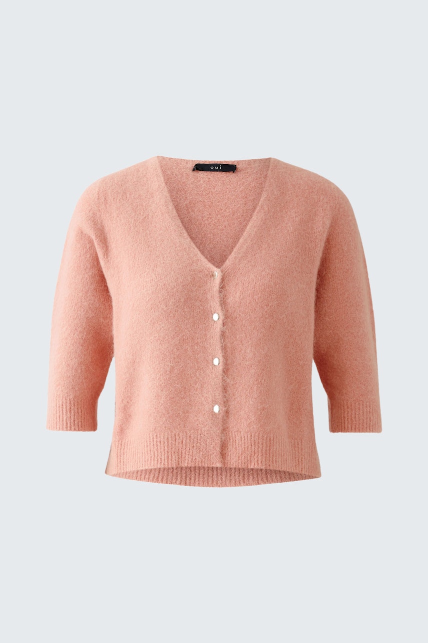 Soft pink cardigan with a V-neck and button closure, perfect for layering.