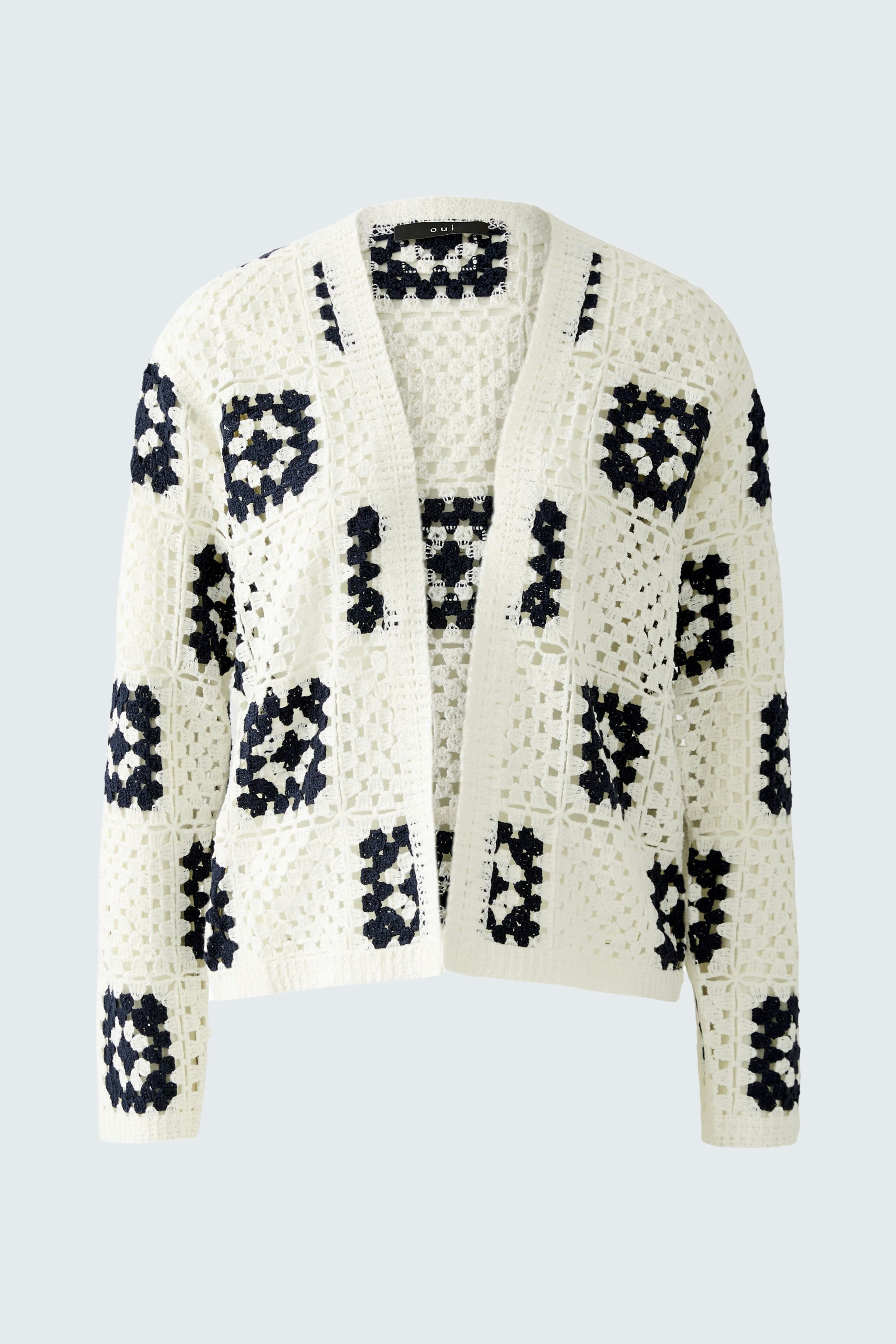 Stylish women's cardigan: Cream with navy patterns, perfect for layering and adding warmth.