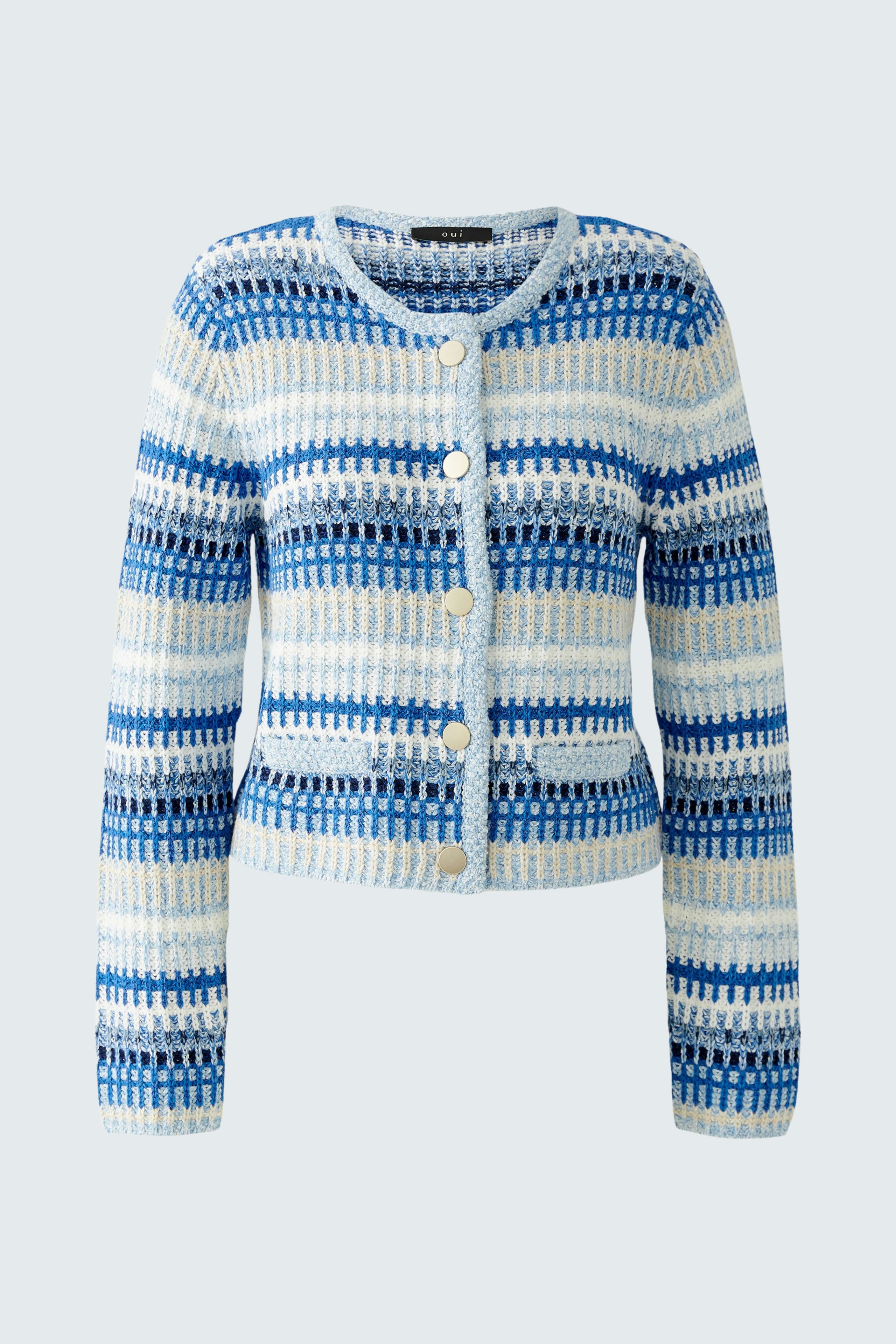 Stylish women's cardigan: A woman in a blue and white striped pullover with buttons, exuding casual elegance.
