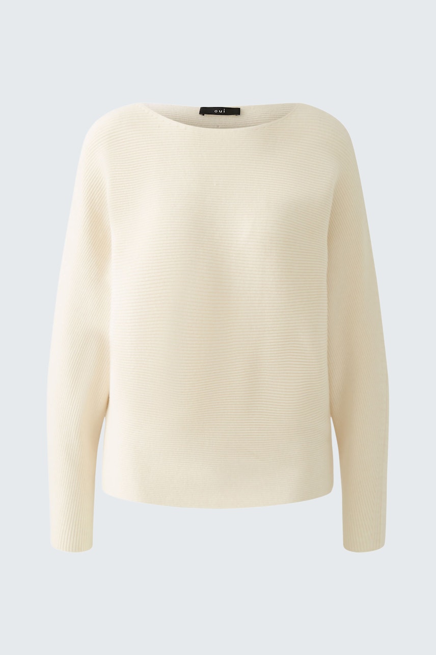 Elegant women's pullover in soft cream color, featuring a relaxed fit and round neckline.