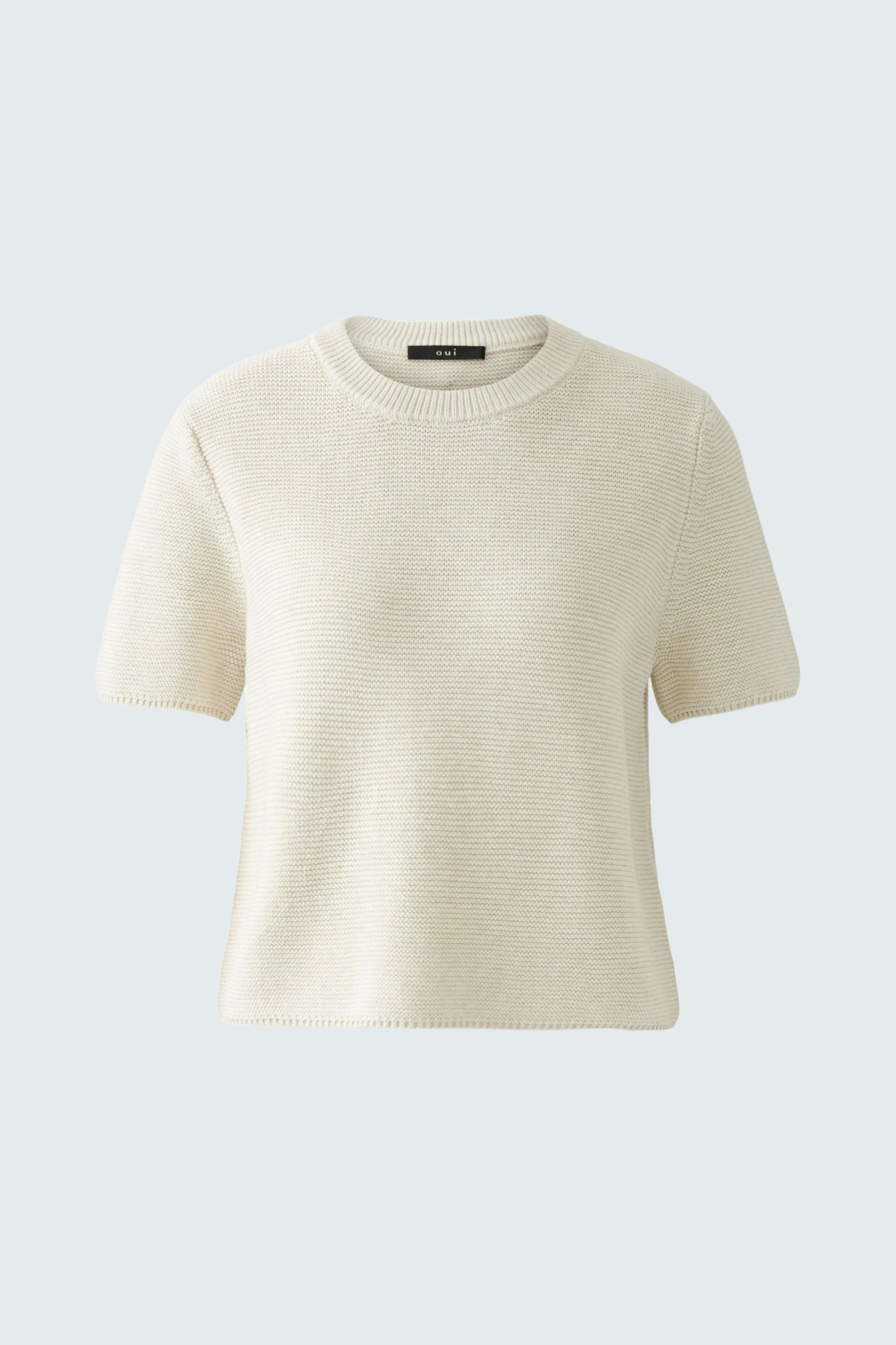 Stylish women's pullover in soft cream with short sleeves, perfect for casual wear.