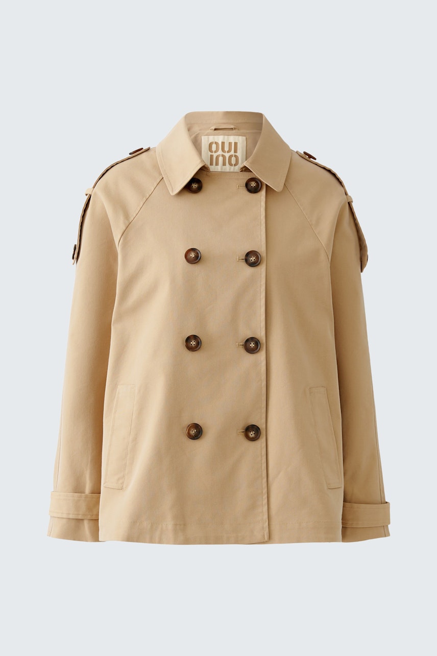 Beige Outdoorjacke: Klassische Damenjacke mit doppelter Knopfleiste und lässigem Schnitt.