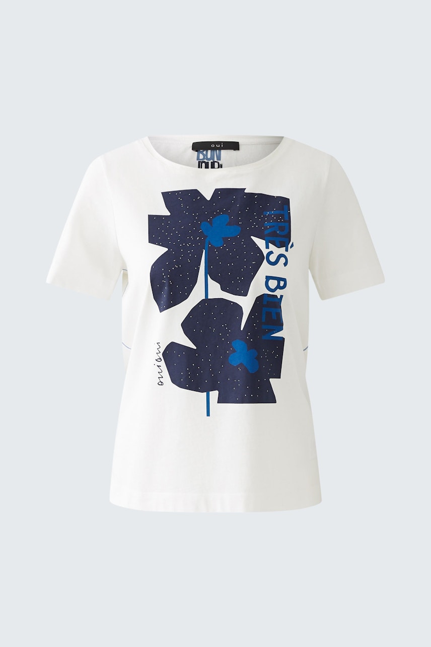 Stylish women's T-shirt: A white tee featuring bold blue floral graphics, perfect for casual wear.