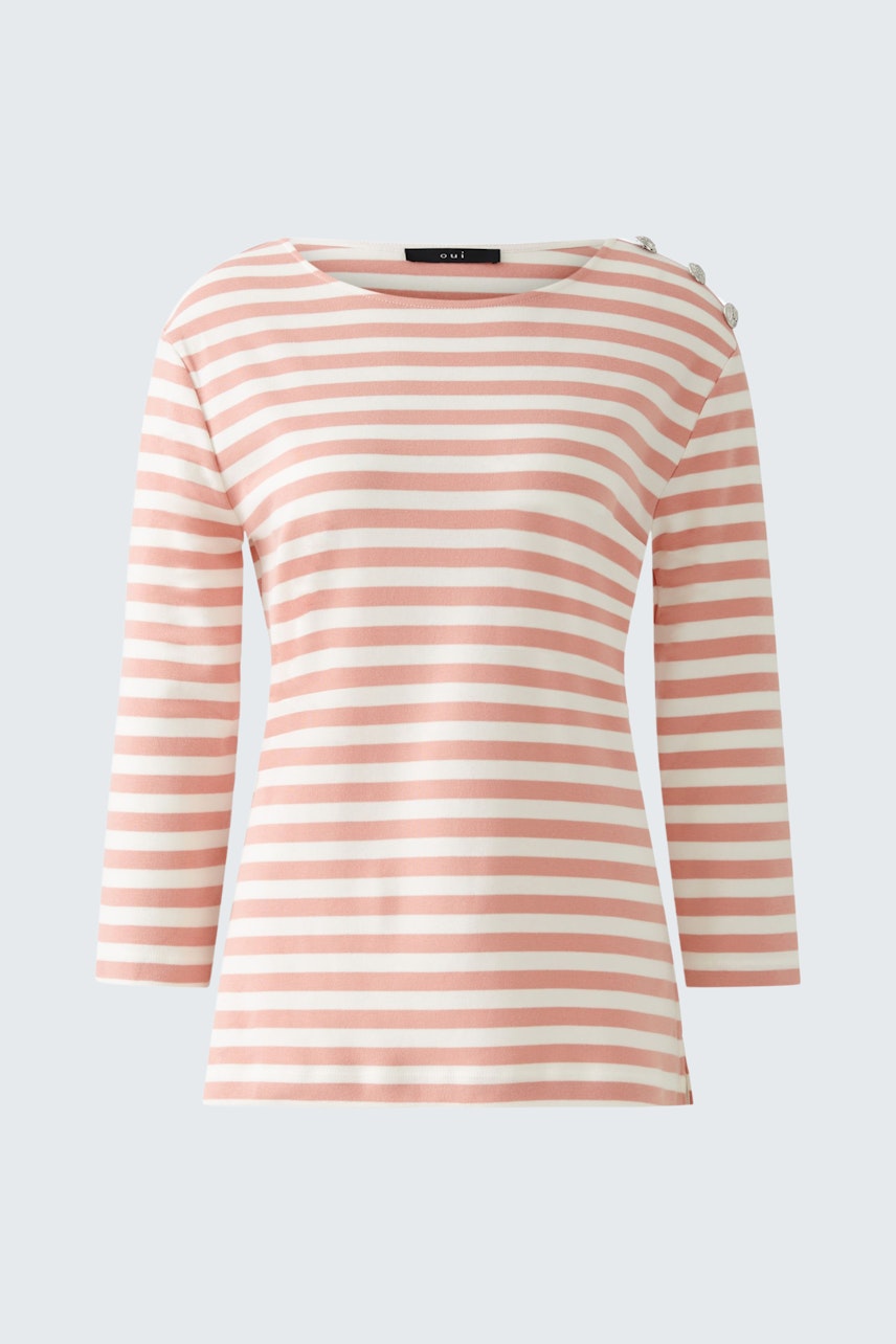 Stylish long-sleeve shirt: A woman in a pink and white striped pullover, perfect for casual wear.