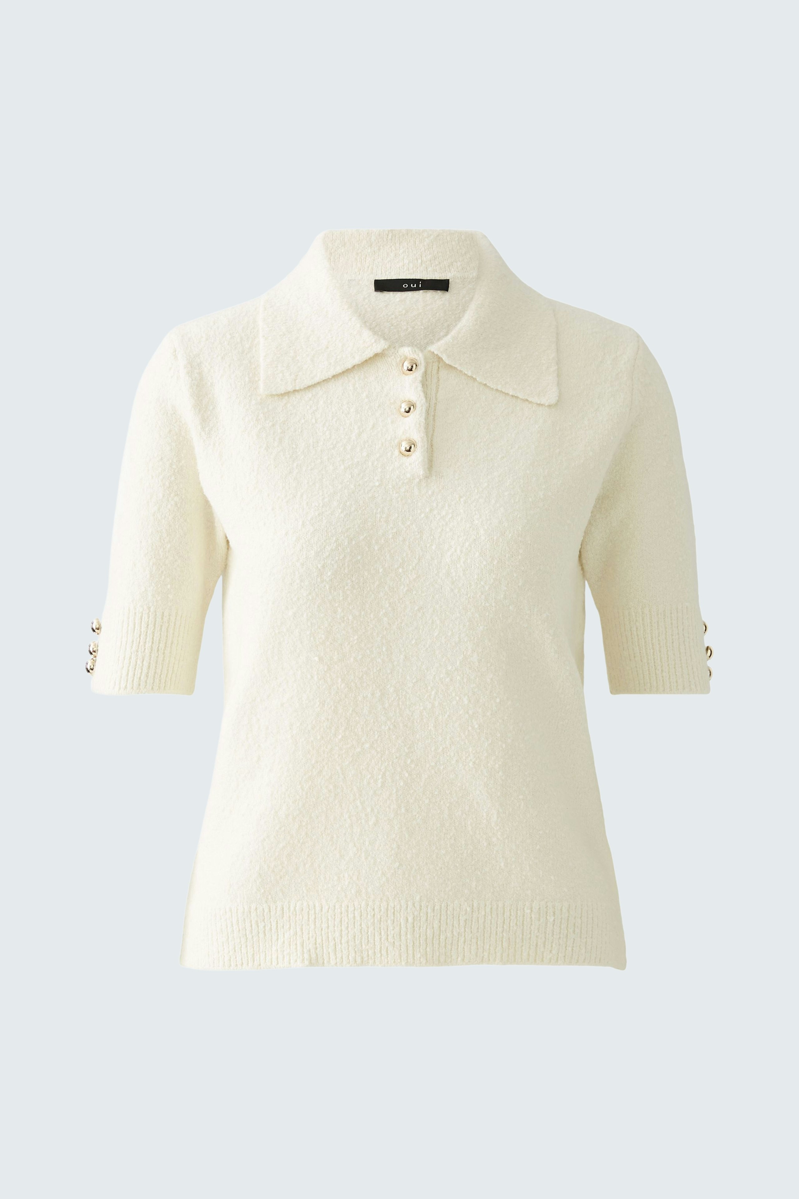 Elegant women's pullover: Cream short-sleeve pullover with a collar and button details.