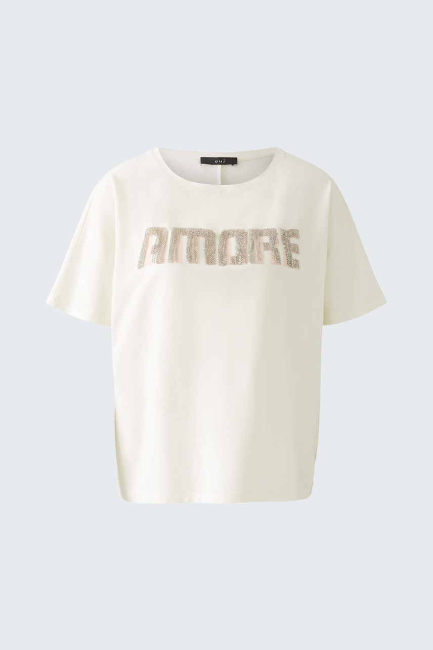 Stylish women's T-shirt in cream with 'AMORE' print, perfect for casual outfits.