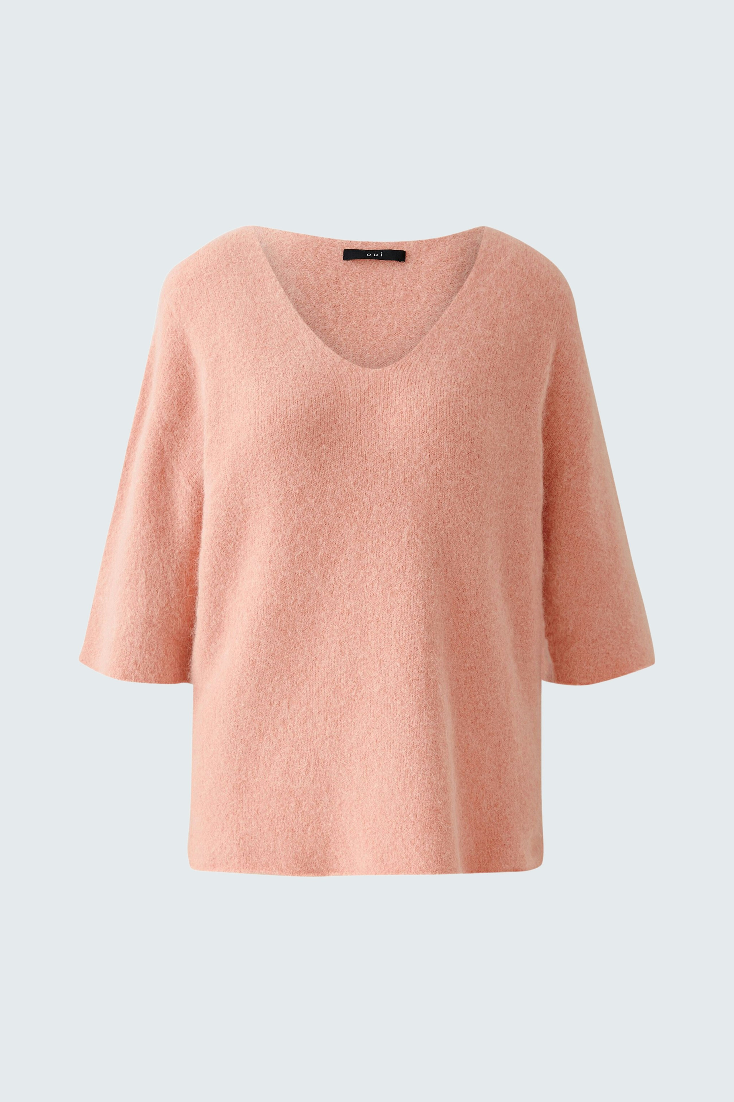 Soft pink pullover with a V-neck and short sleeves, perfect for casual wear.