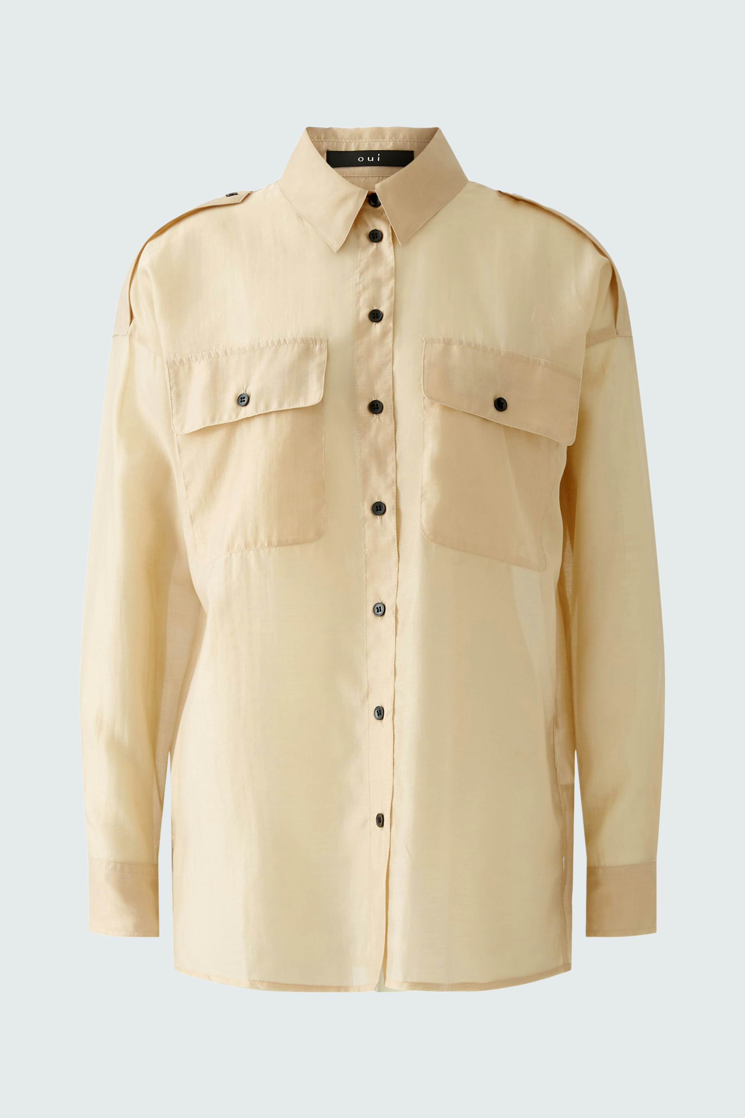 Stylish women's blouse in soft beige with button-up front and chest pockets.