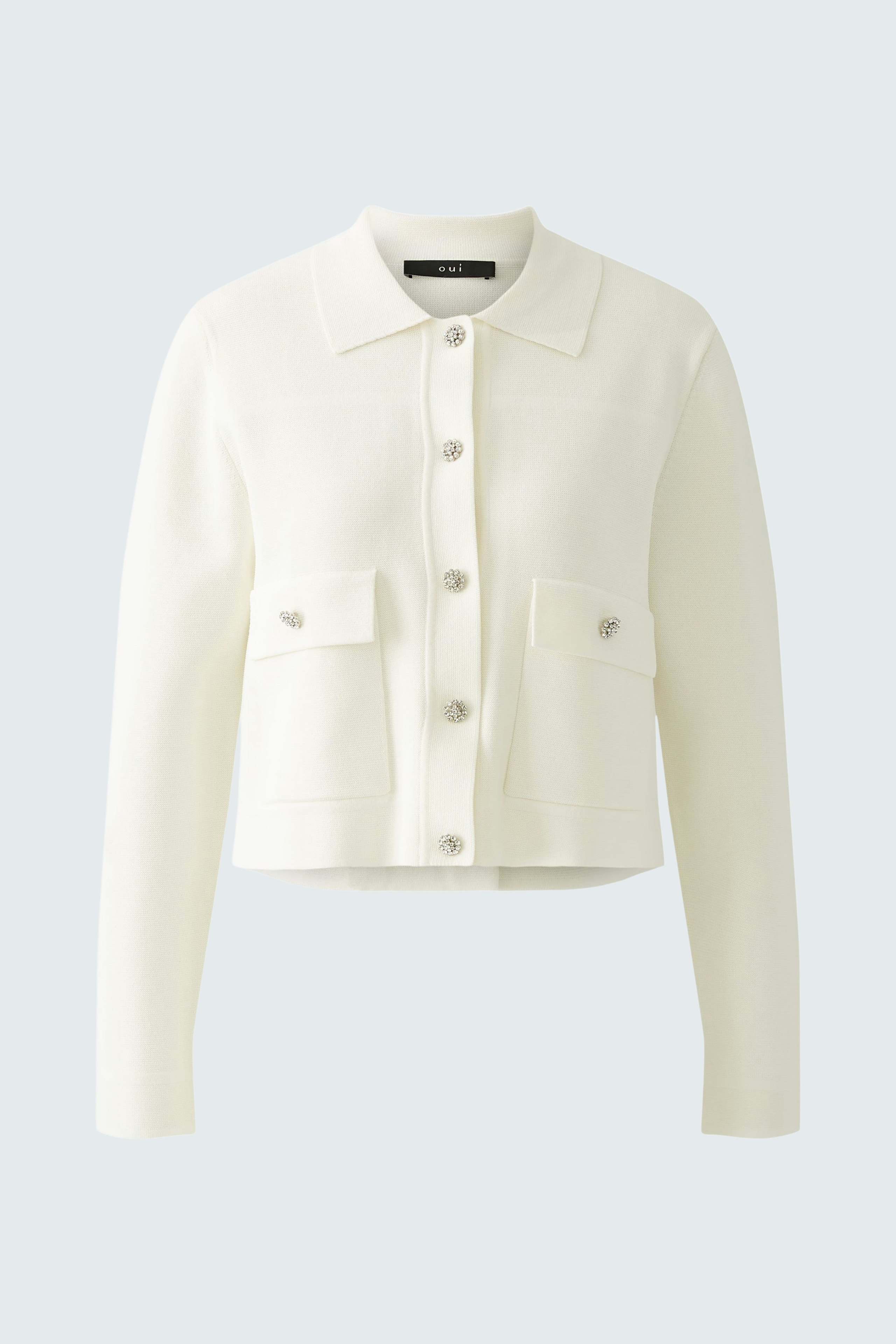 Chic women's cardigan in white with button details and front pockets, perfect for layering.