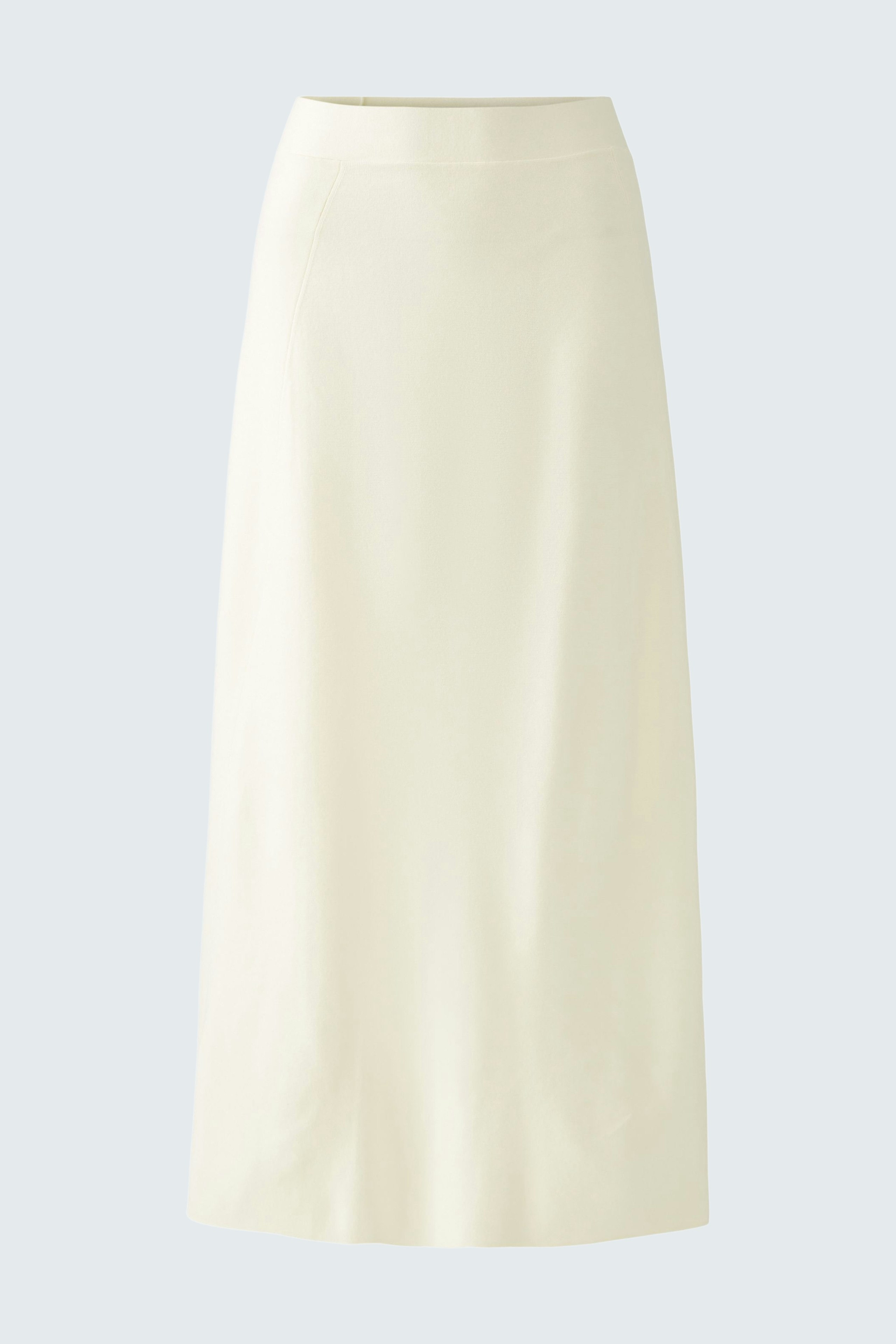 Elegant women's knitted skirt in soft cream color, perfect for versatile styling.
