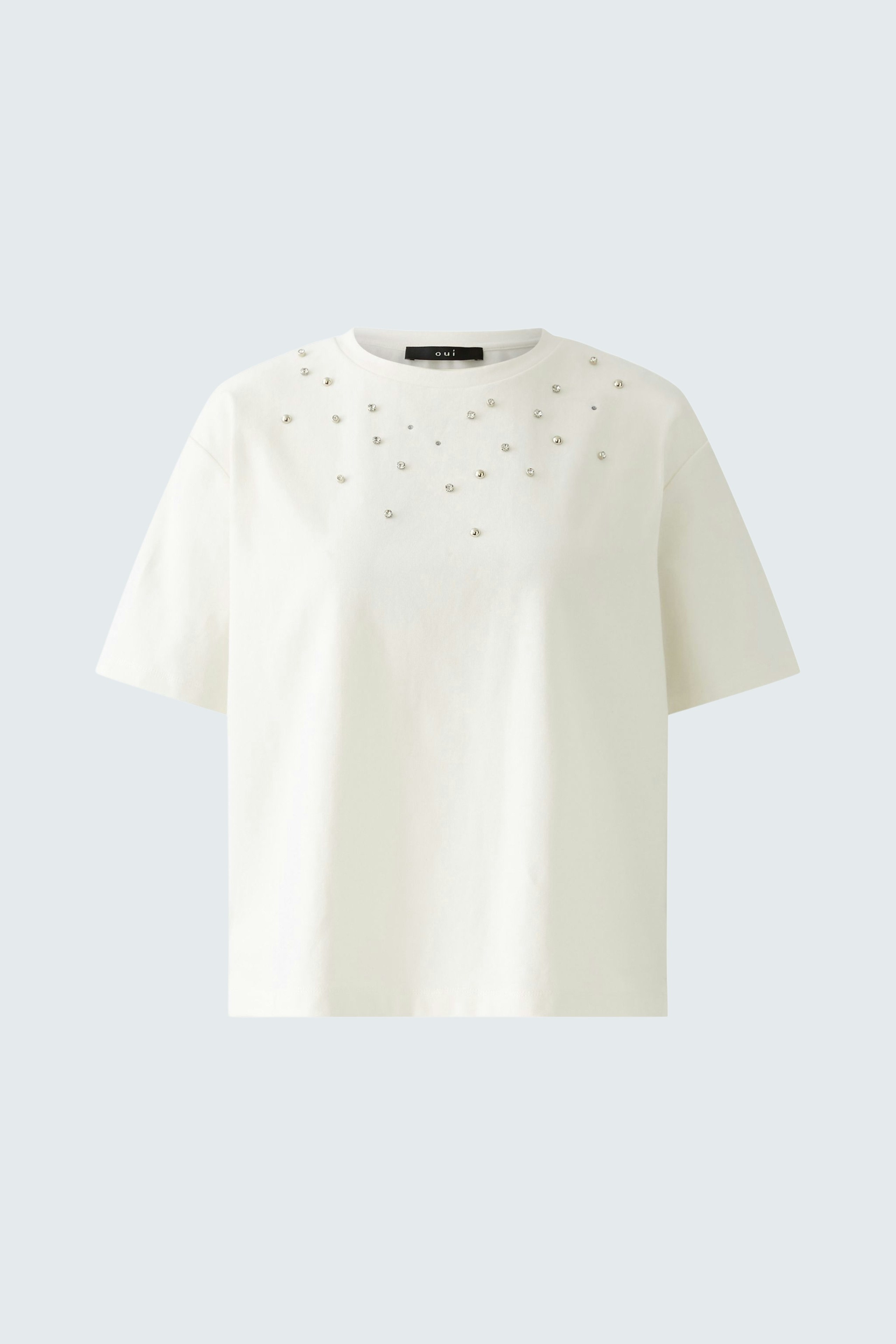 Stylish women's T-shirt in white with decorative embellishments for a chic look.