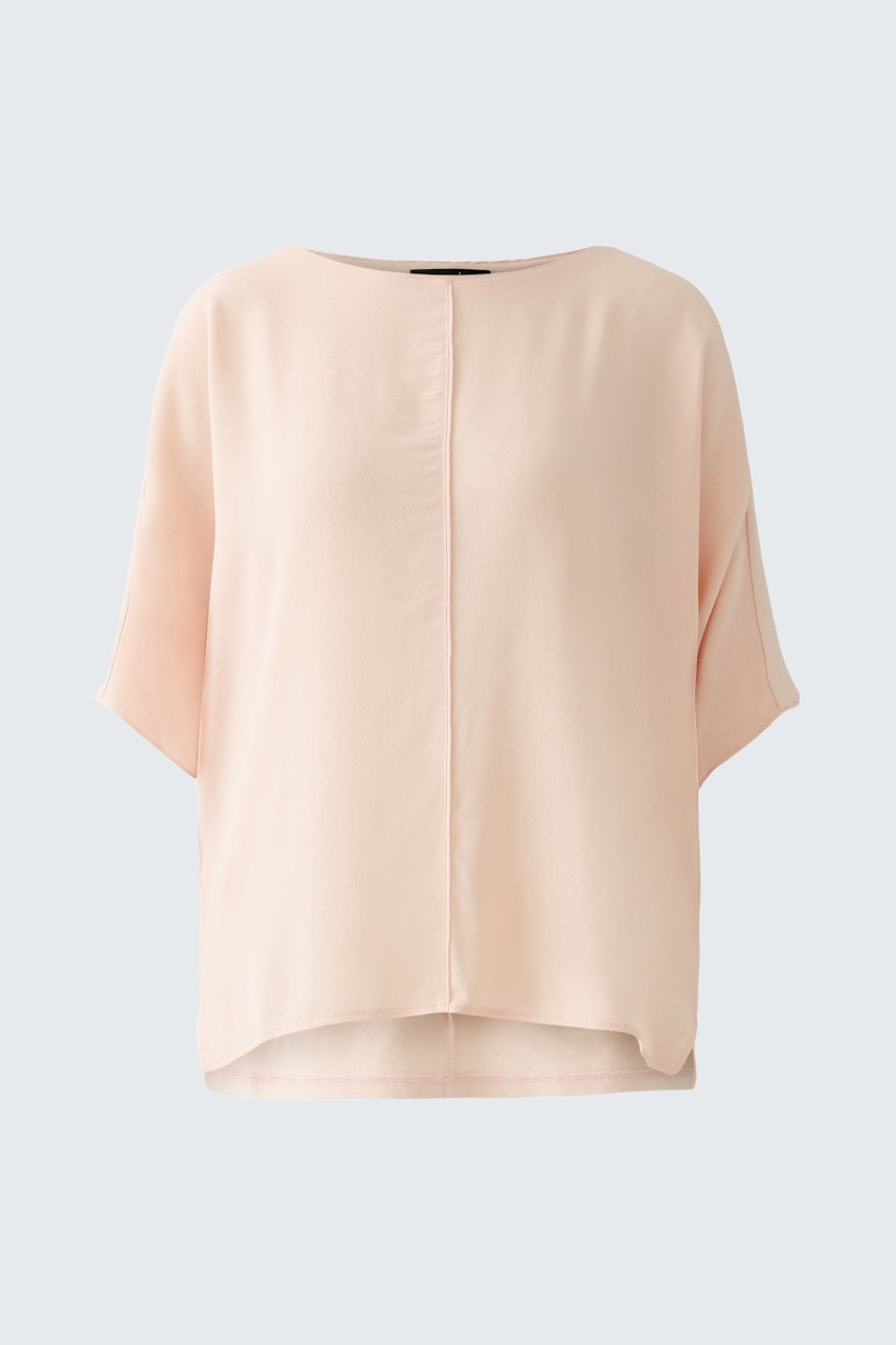 Elegant women's blouse shirt in soft pink, featuring a relaxed fit and short sleeves.