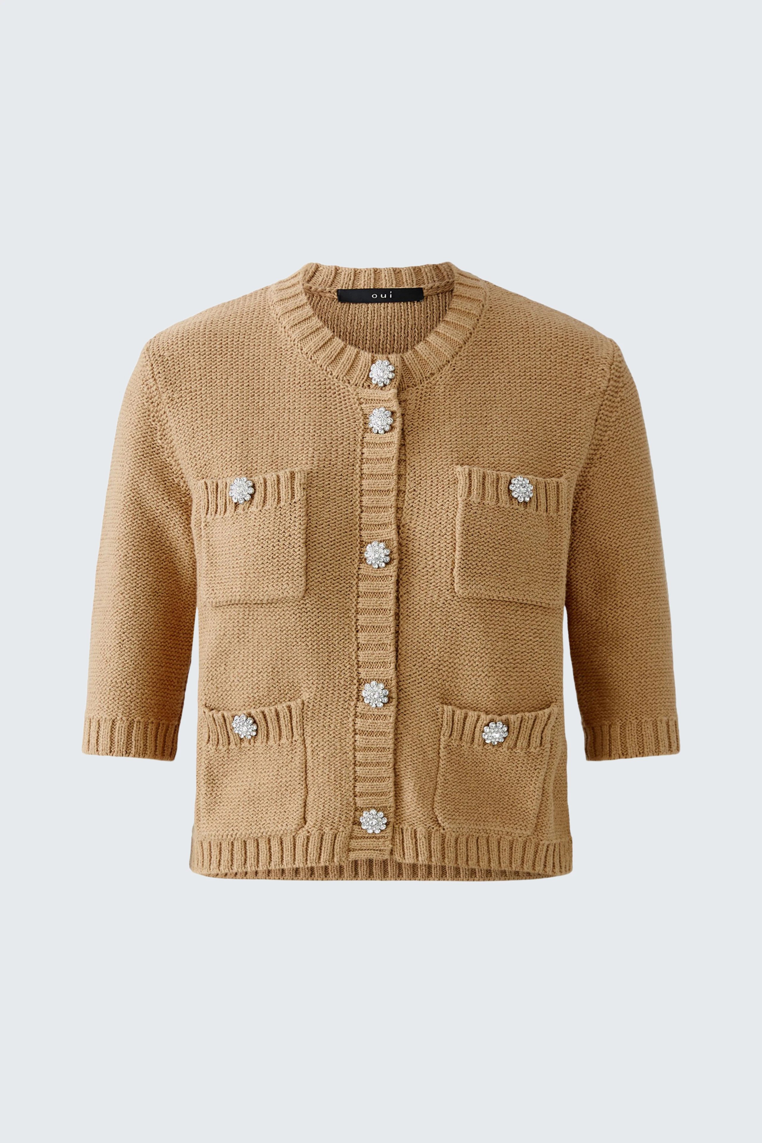 Casual women's cardigan in soft beige with decorative buttons and pockets.