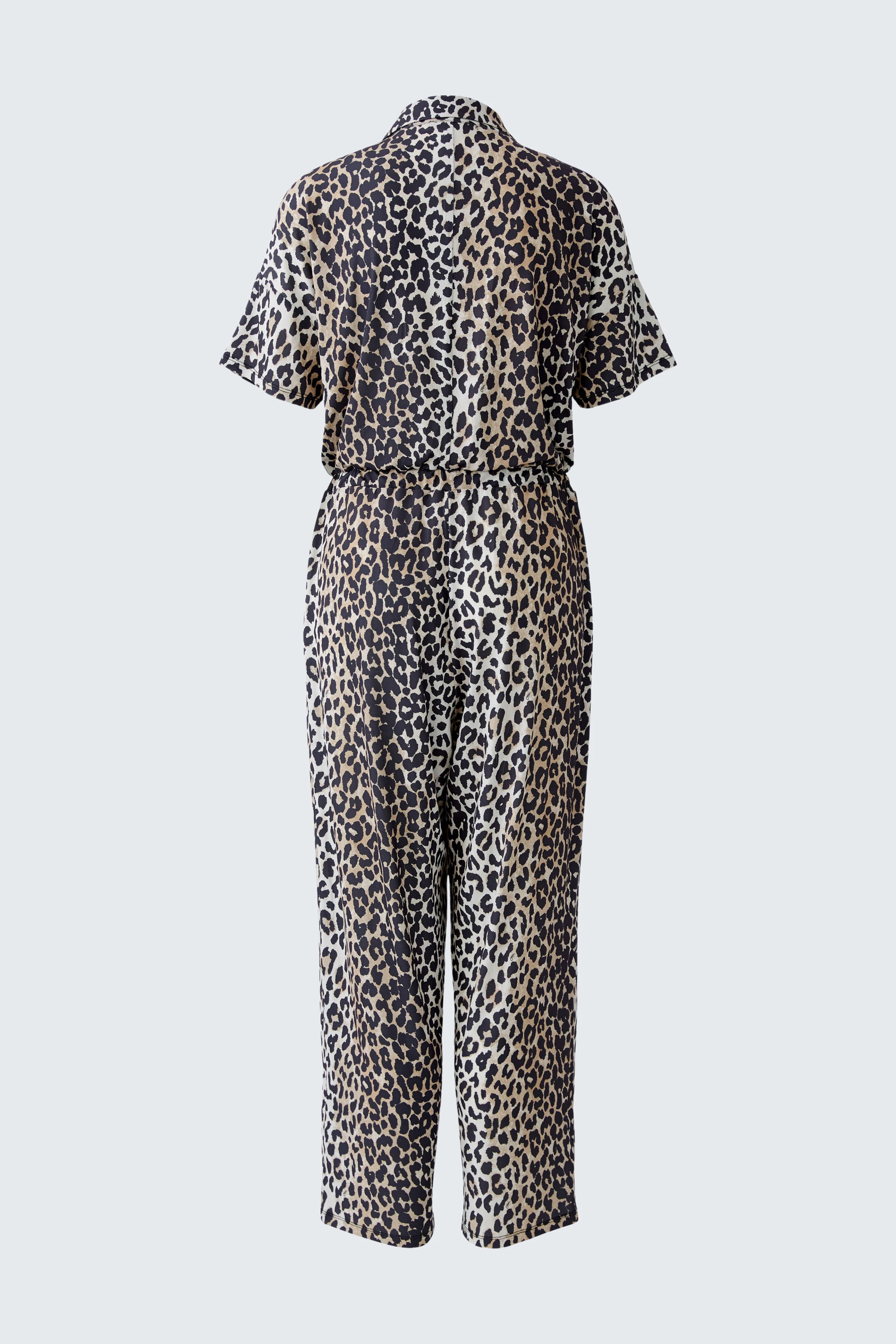 Leopard print jumpsuit: A woman in a stylish, short-sleeved jumpsuit with a cinched waist.