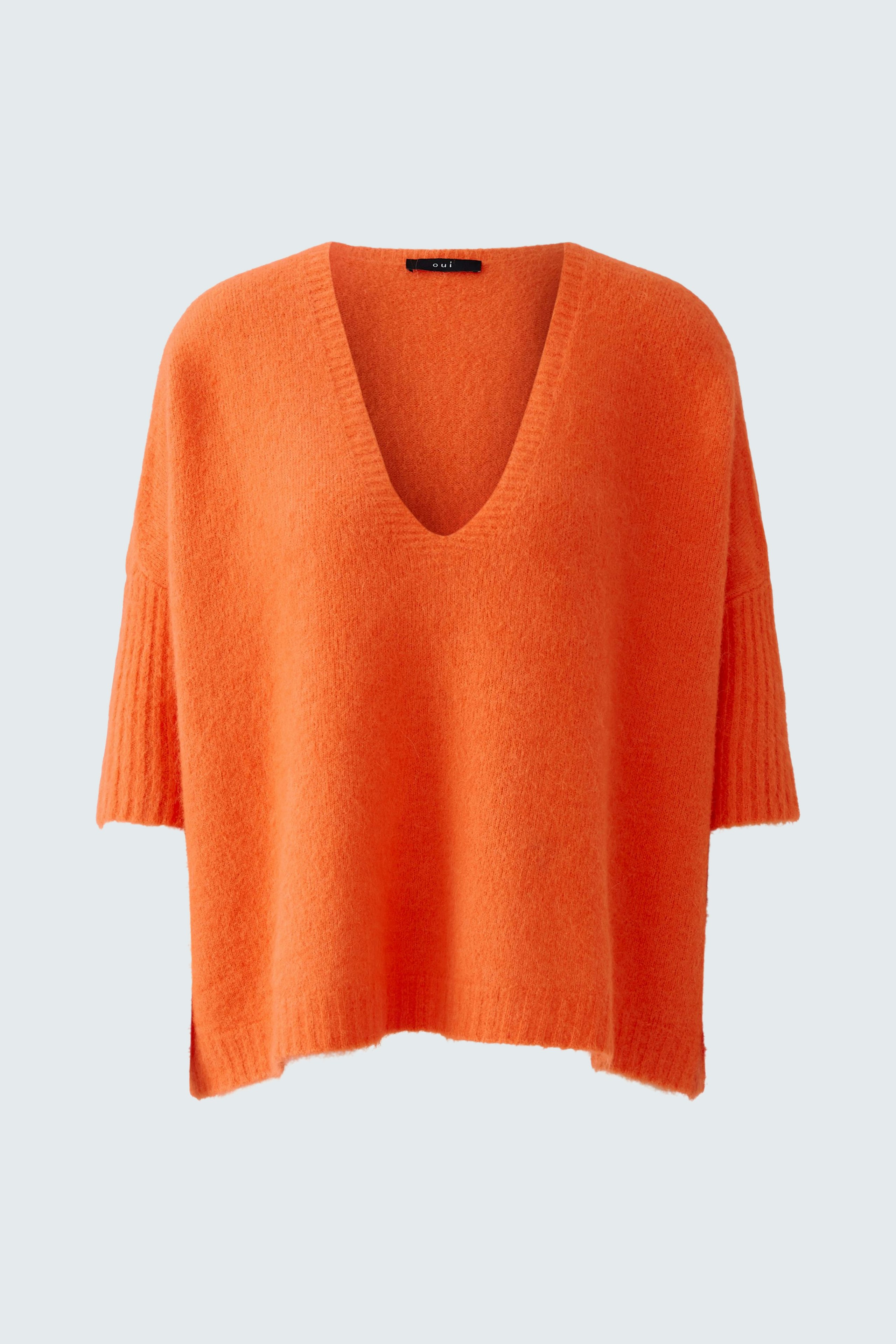 Casual women's pullover: Bright orange V-neck pullover with a relaxed fit.
