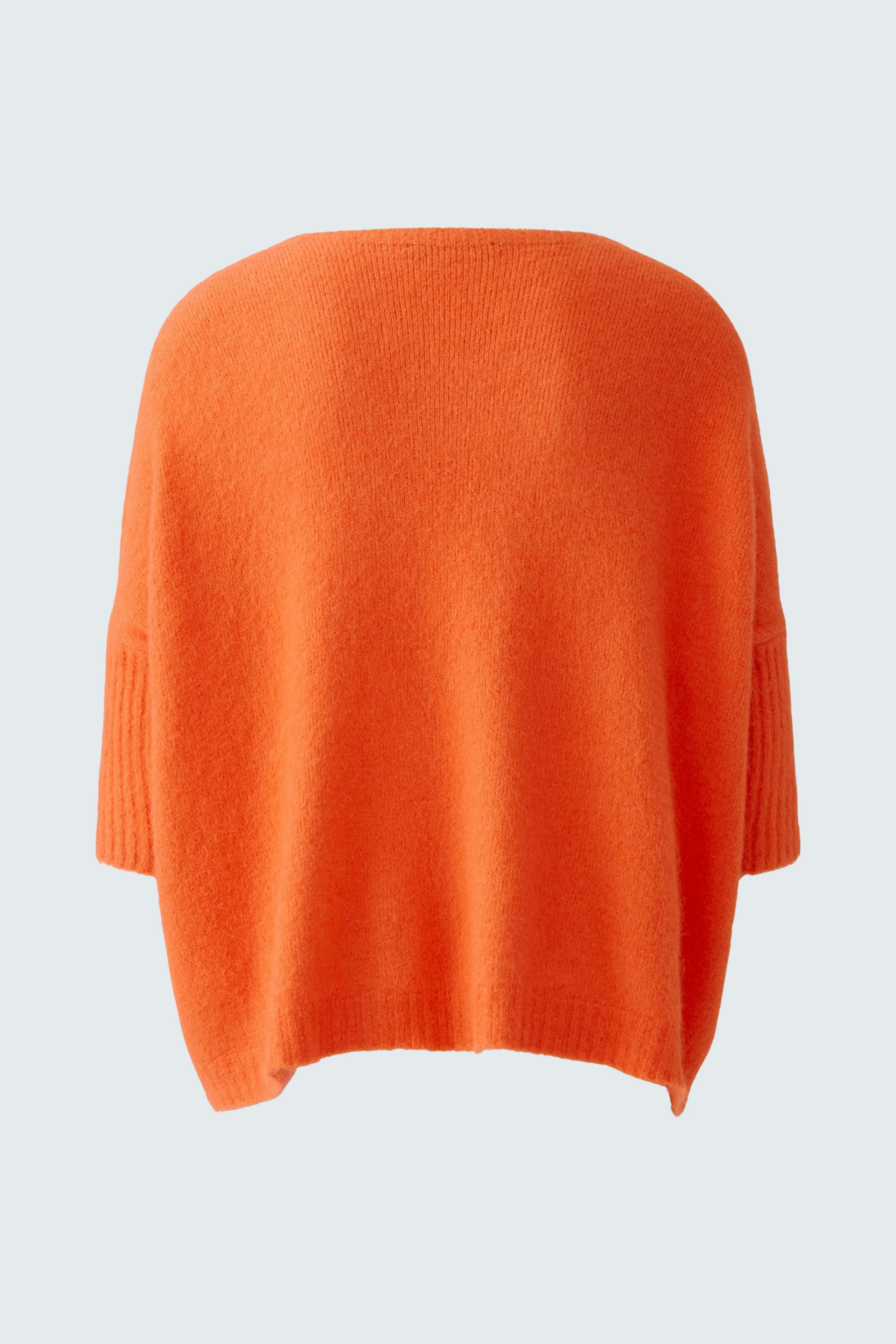 Casual women's pullover in vibrant orange, featuring a relaxed fit and soft texture.