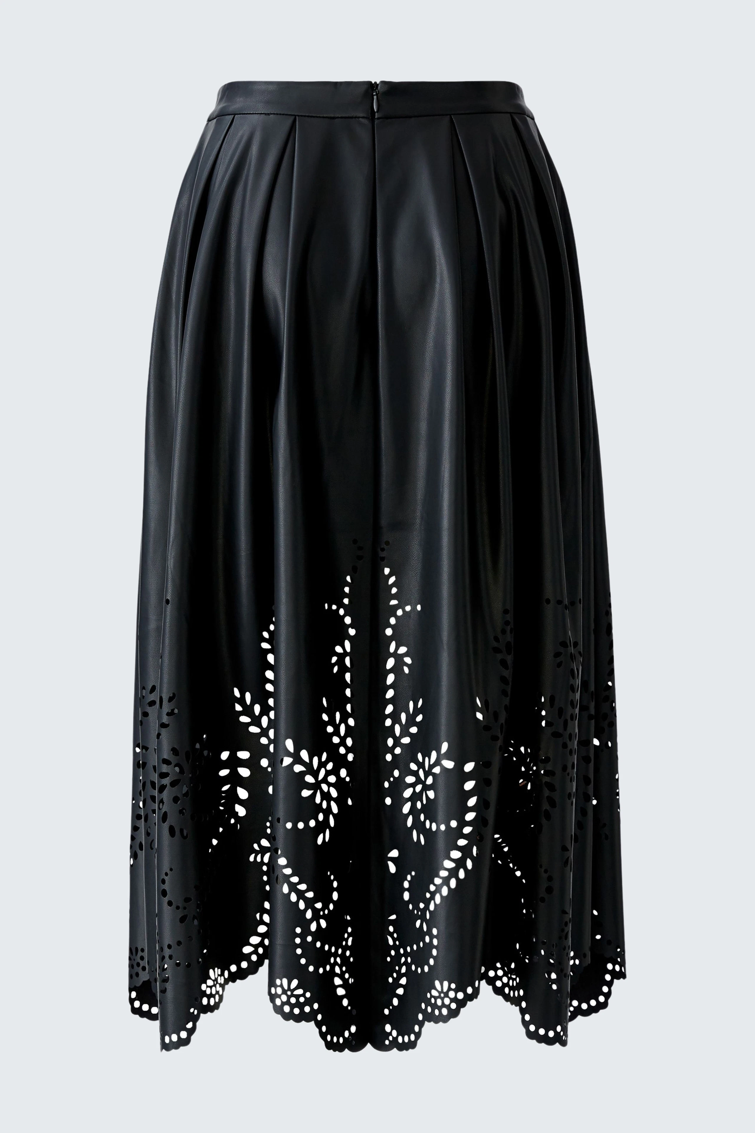 Black faux leather skirt with a pleated design and decorative cutouts.