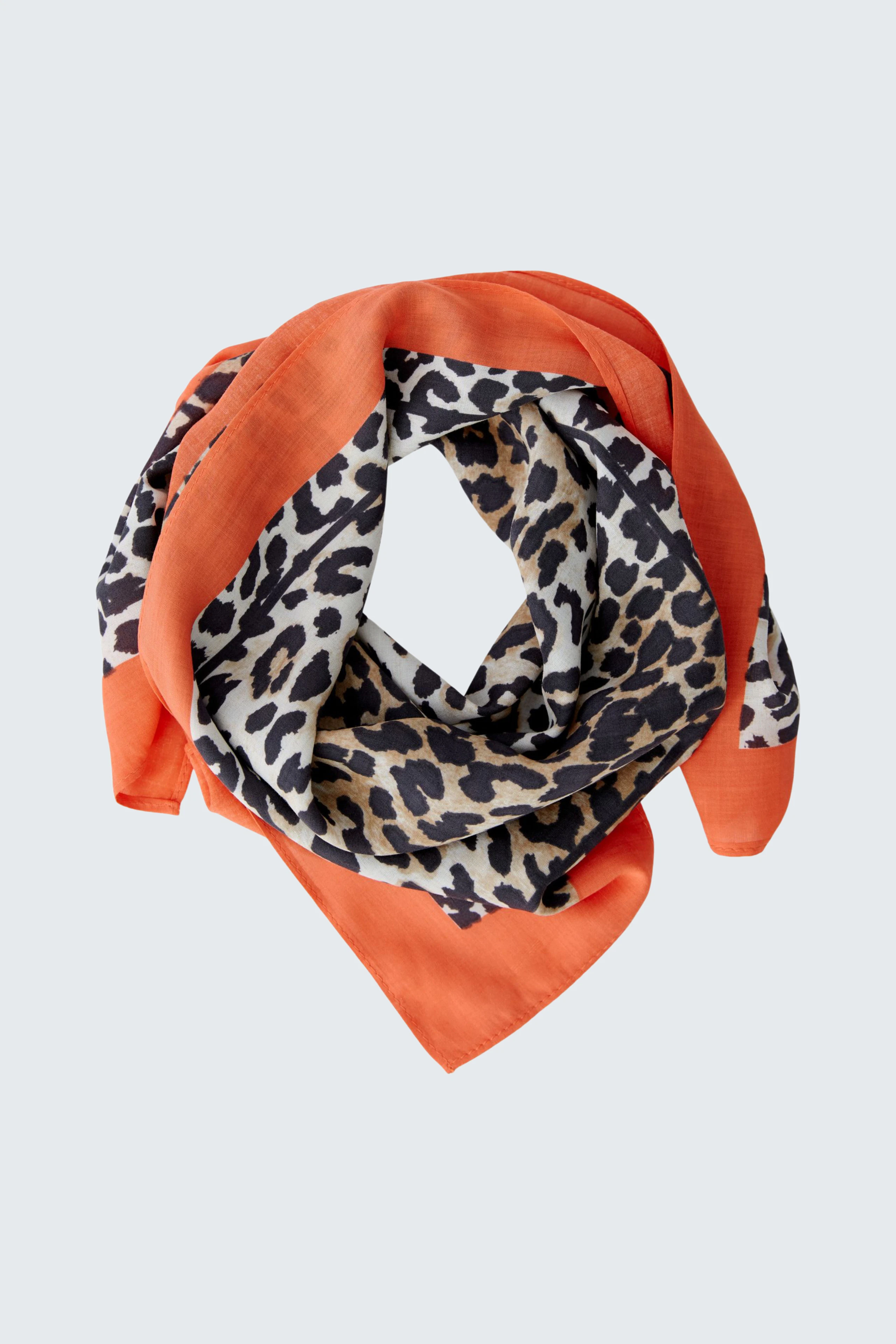 Stylish women's scarf in orange and leopard print, perfect for adding flair to any outfit.