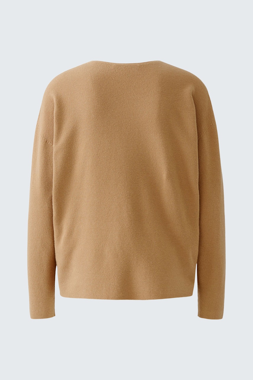 Casual women's pullover in soft beige, featuring a relaxed fit and simple design.