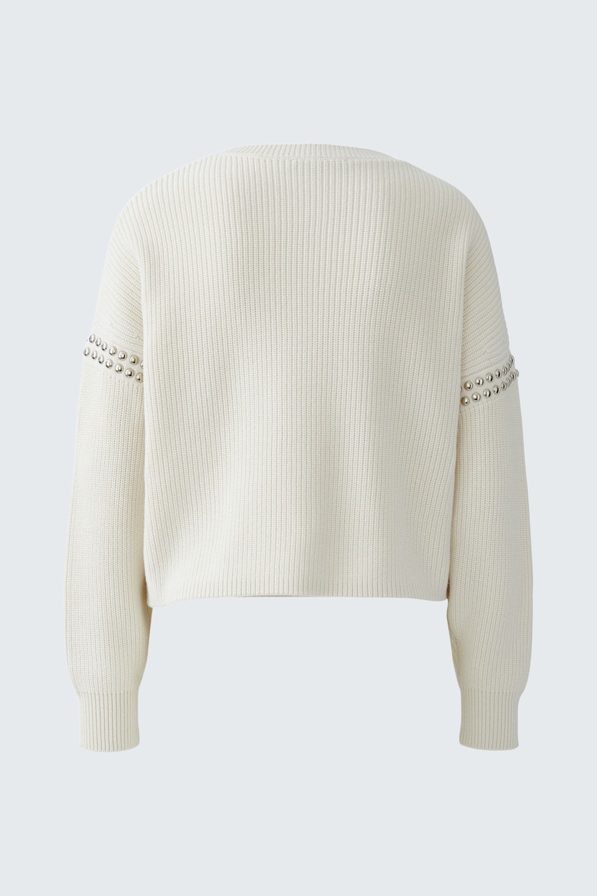 Casual women's pullover: Back view of a cream ribbed pullover with stylish detailing.