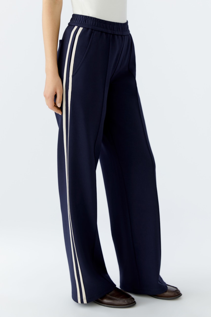 Comfortable women's joggers in navy with side stripes, perfect for casual wear.