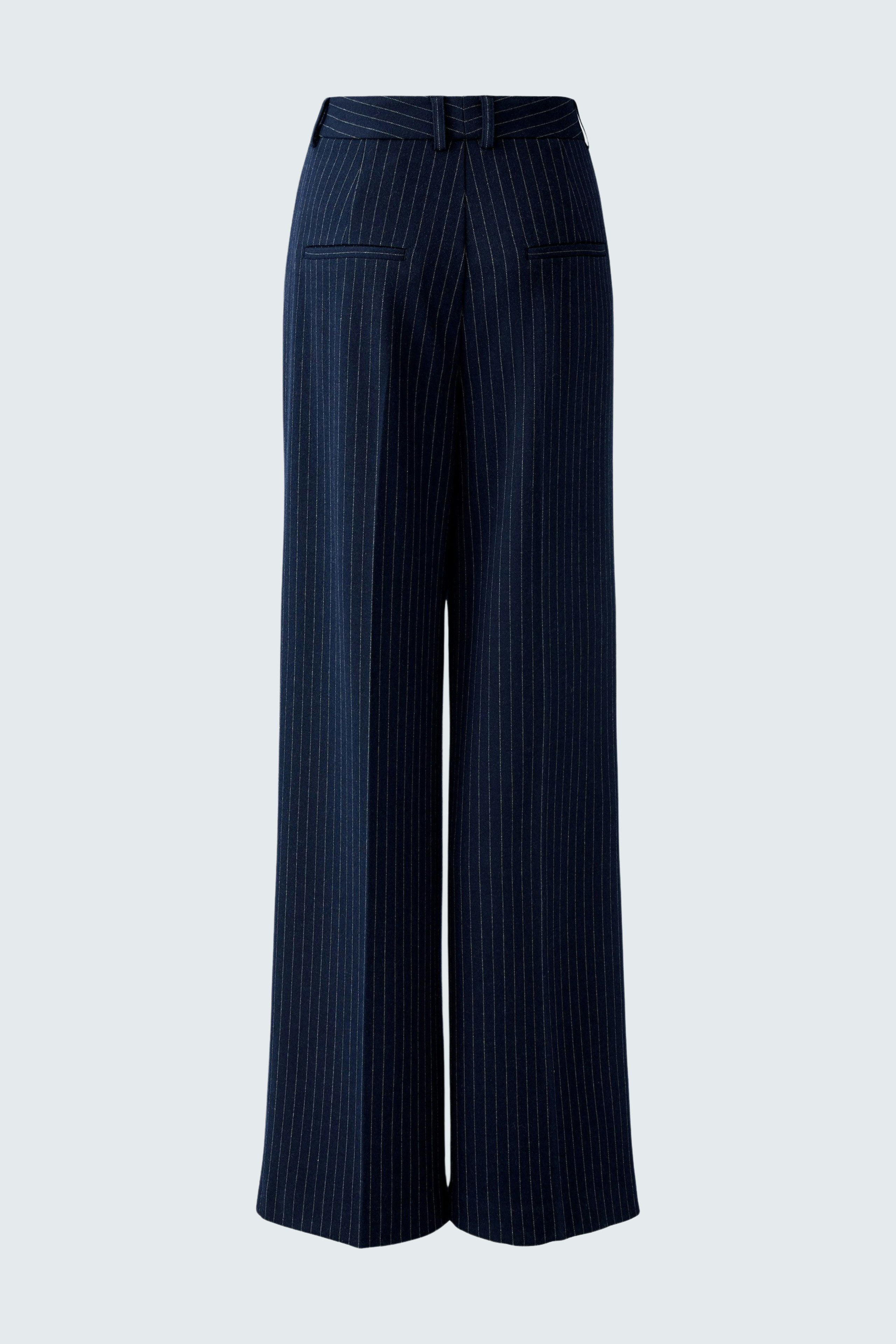Wide-leg trousers: A woman in navy pinstriped trousers with a high waist and relaxed fit.