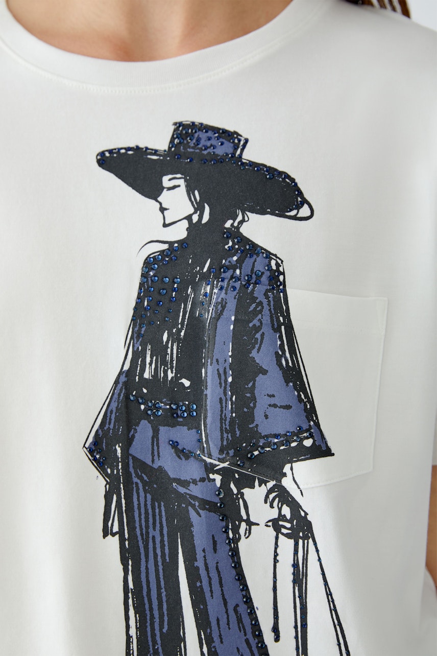 Casual women's T-shirt featuring a graphic print of a woman in a stylish outfit.