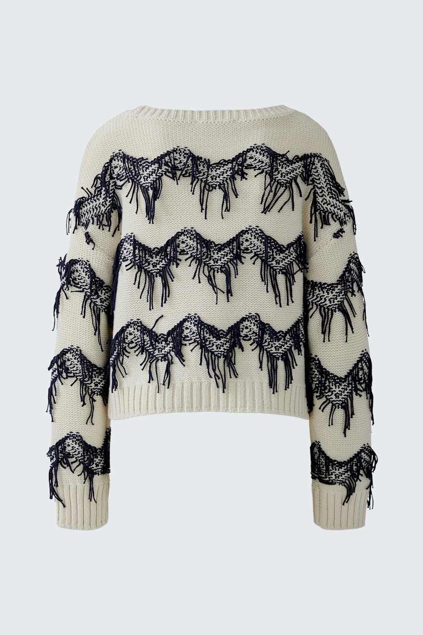 Casual women's pullover: Cream pullover with navy fringe detailing, perfect for relaxed outfits.
