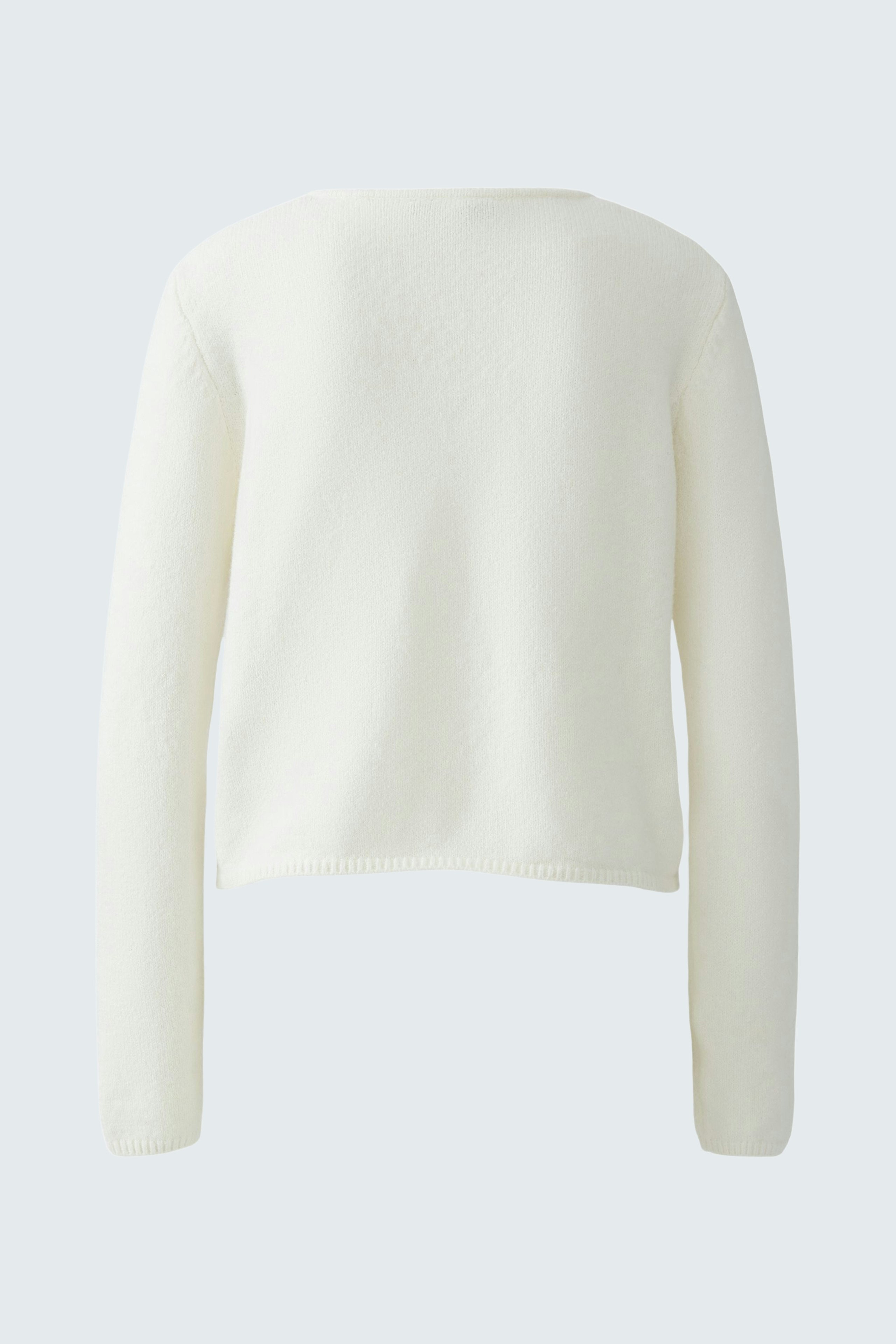 Casual women's cardigan in soft white, featuring a relaxed fit and long sleeves.