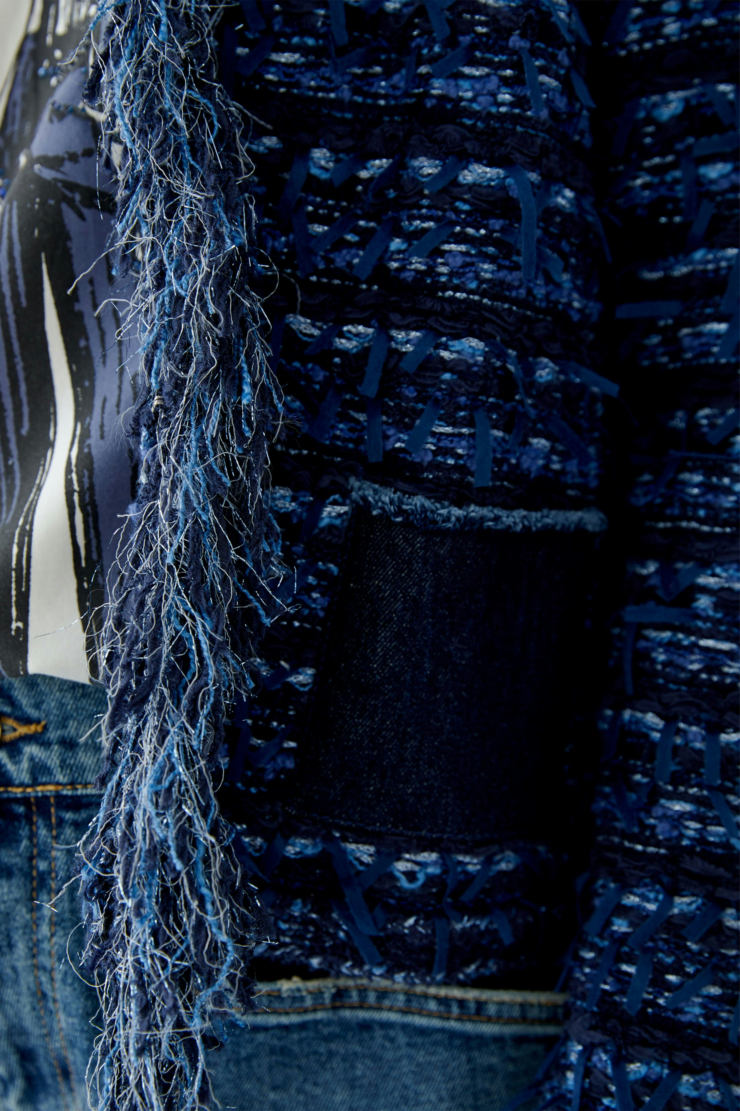 Casual women's cardigan in blue with textured fabric and fringe details, perfect for layering.