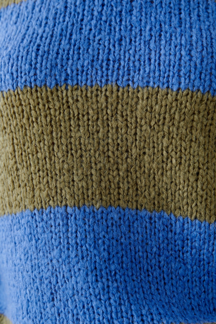 Casual women's pullover in blue and olive stripes, showcasing a cozy knit texture.