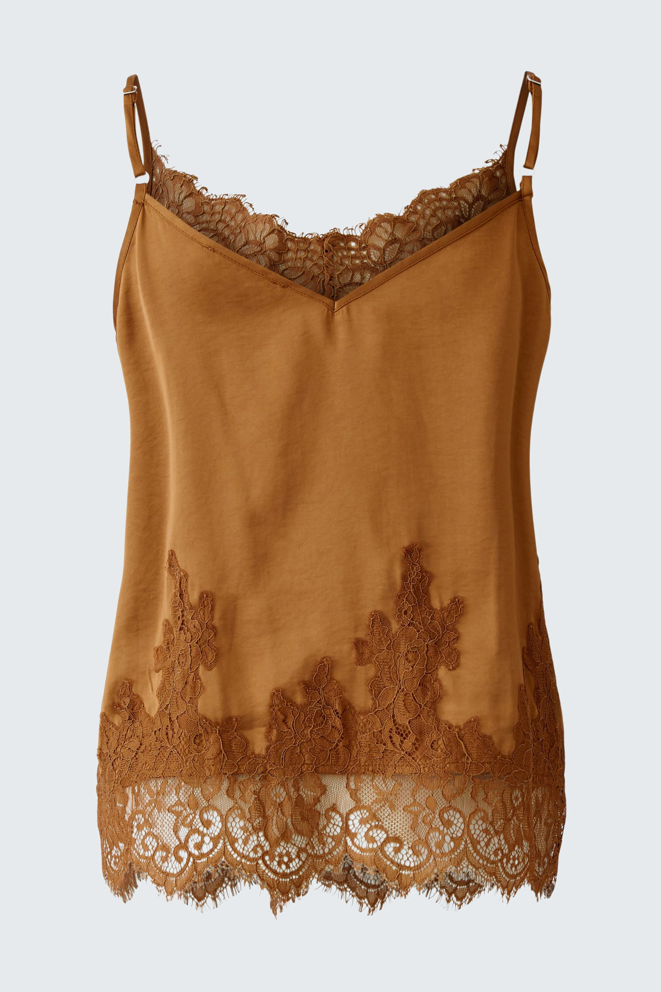 Casual women's top: A woman in a brown lace-trimmed tank top with adjustable straps.