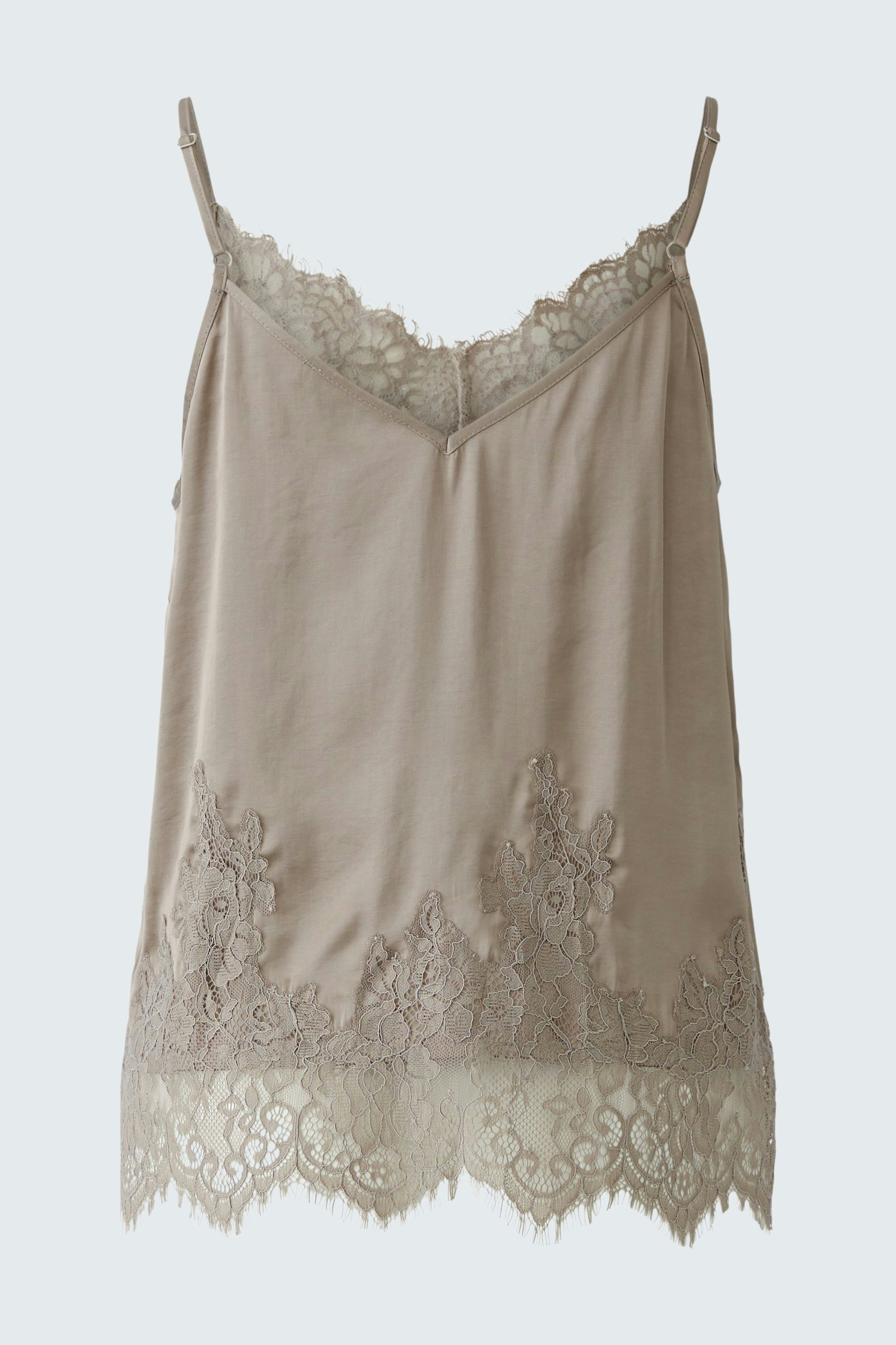 Light beige top with lace trim, featuring thin straps and a relaxed fit.