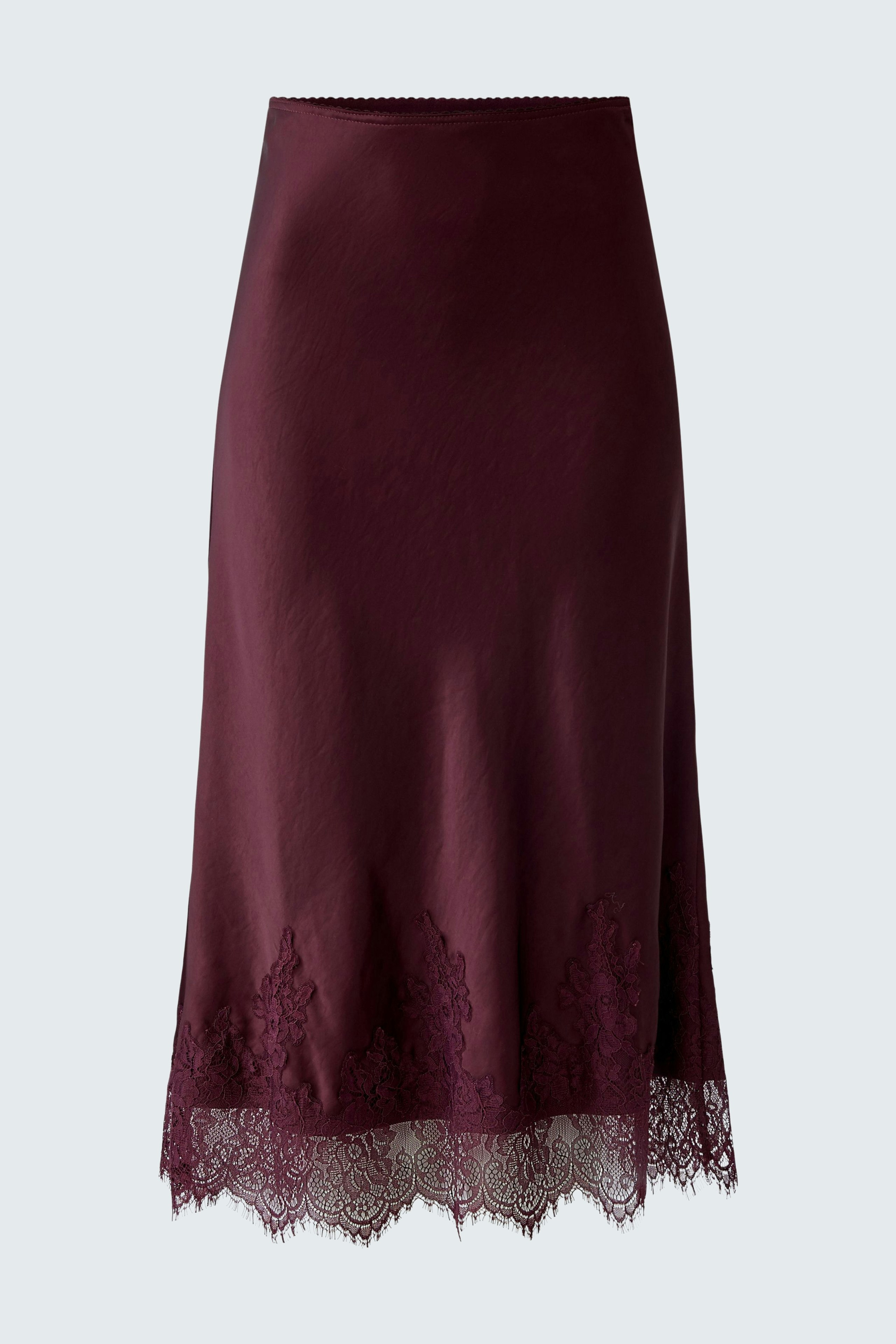 A-line skirt: A woman in a burgundy skirt with lace detailing, showcasing a stylish and casual look.