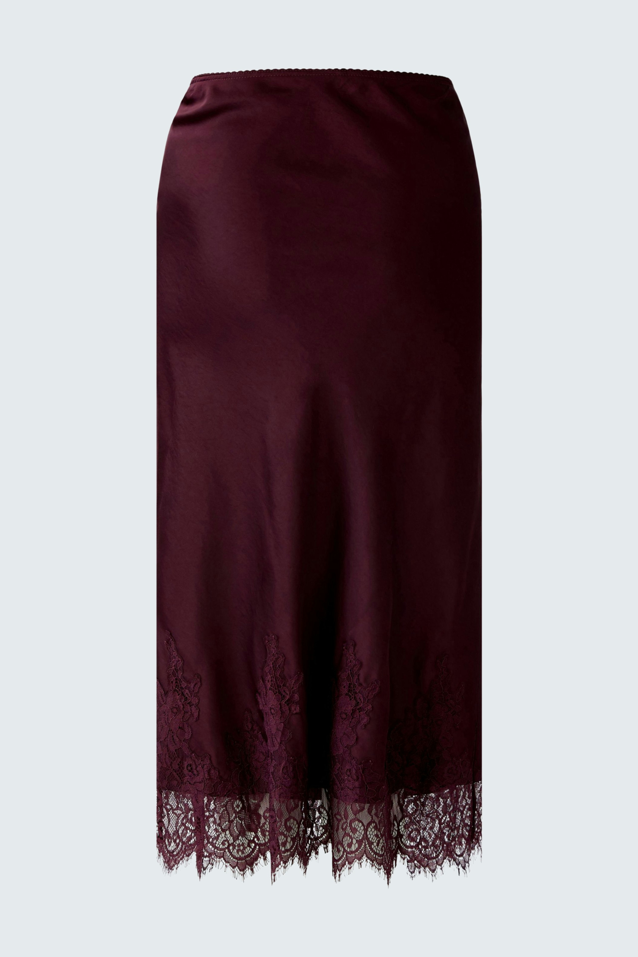 A-line skirt: A woman in a burgundy skirt with lace trim, showcasing a casual and stylish look.