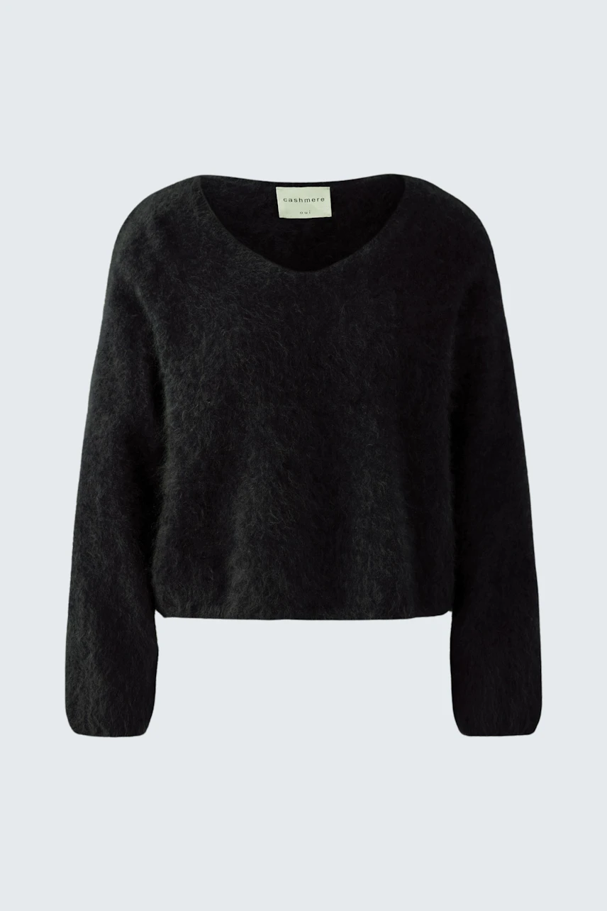 Cozy women's pullover in black with a relaxed fit and V-neck design.