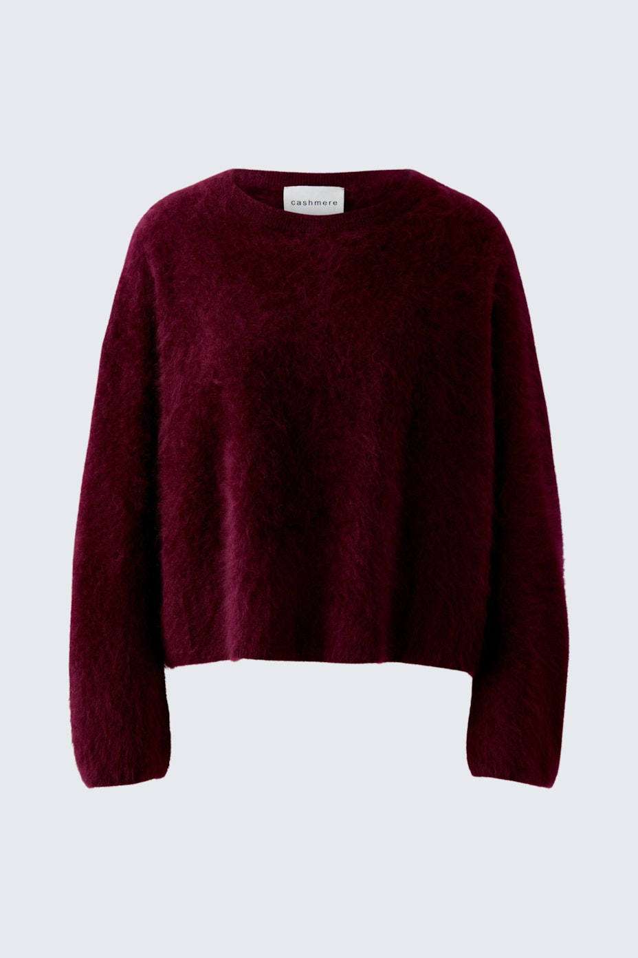 Cozy women's pullover in deep burgundy, featuring a relaxed fit and soft texture.