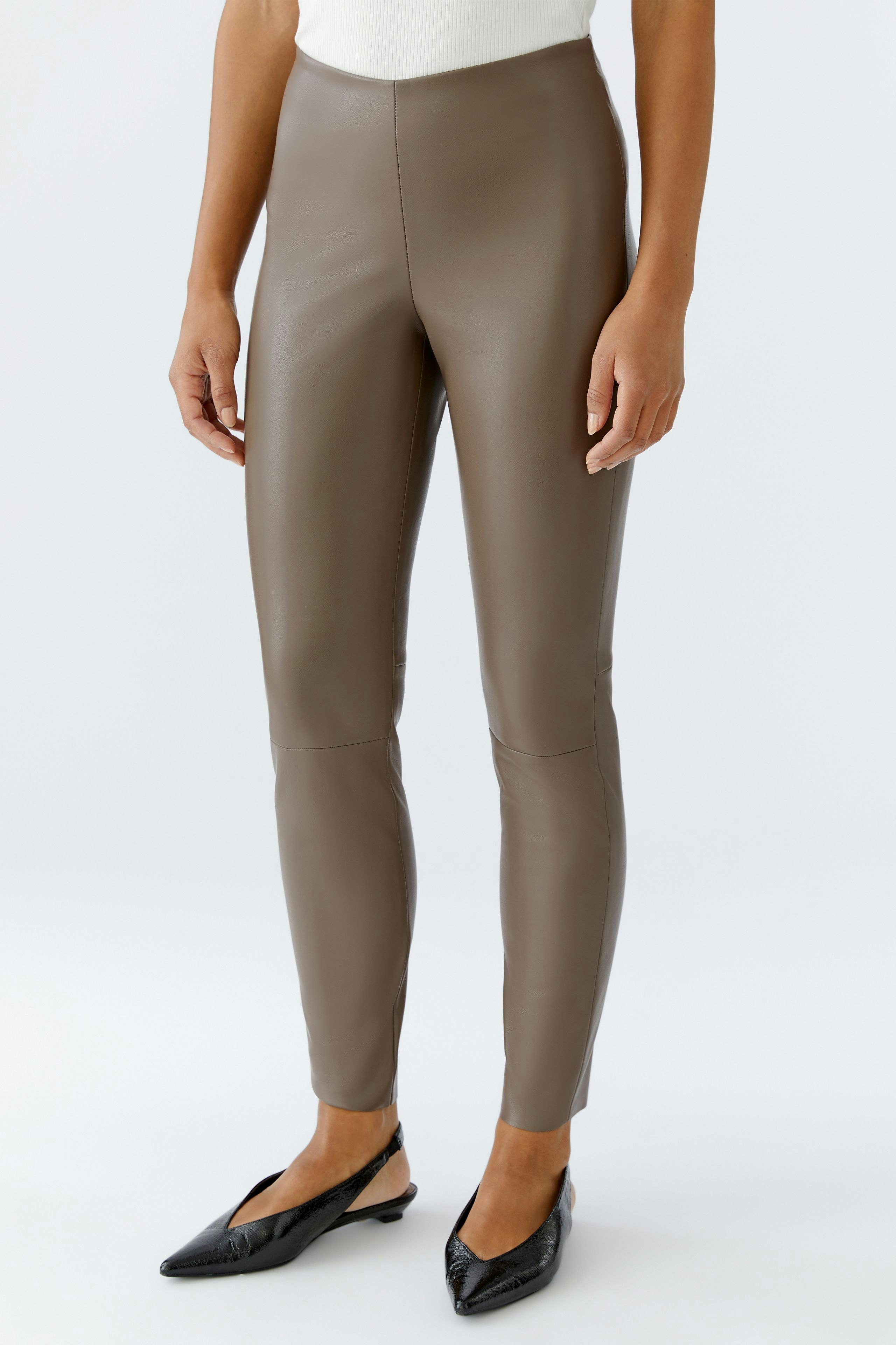 Stylish women's leggings in a sleek brown finish, perfect for casual wear.