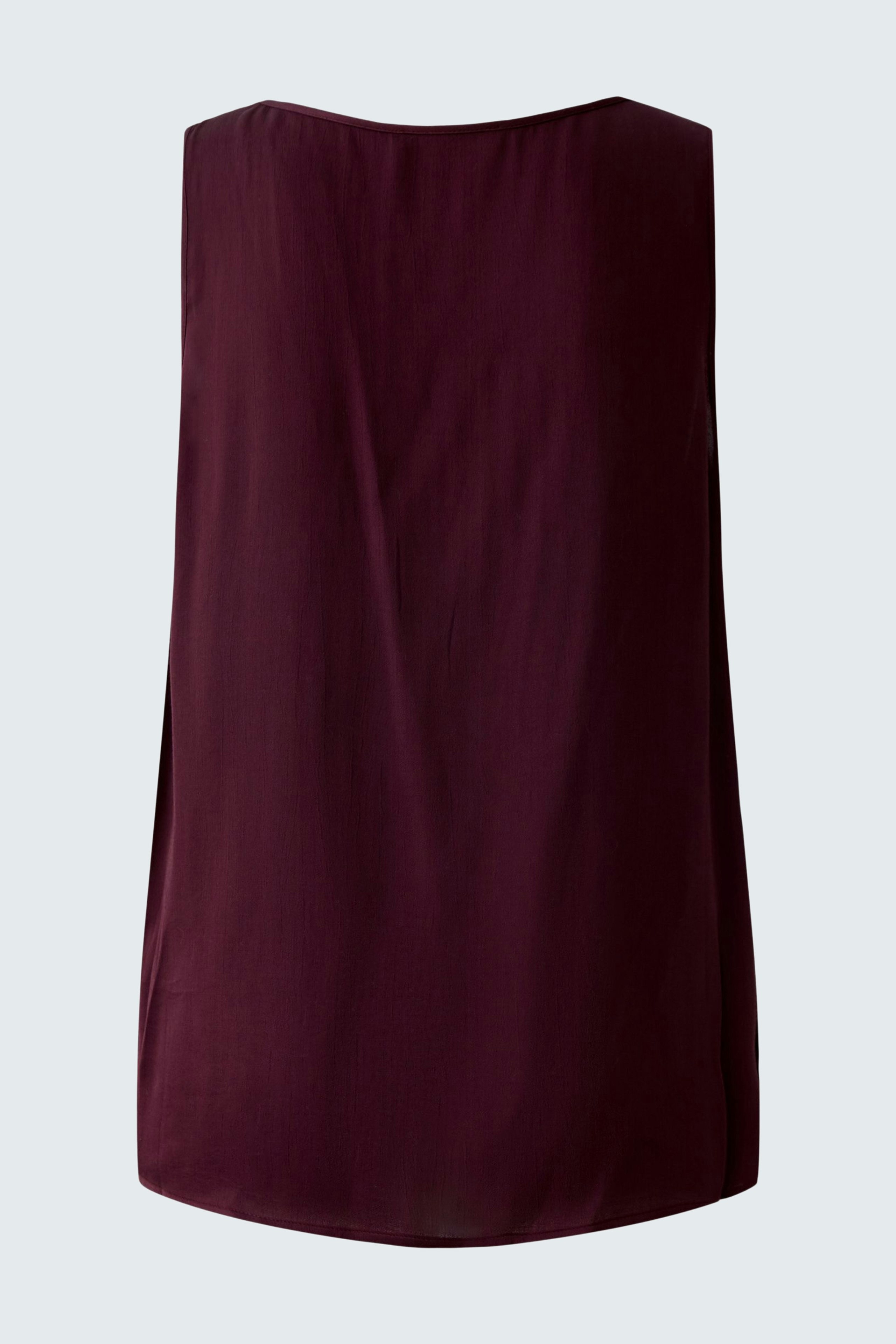 Casual women's top: A simple maroon sleeveless top with a relaxed fit, perfect for everyday wear.