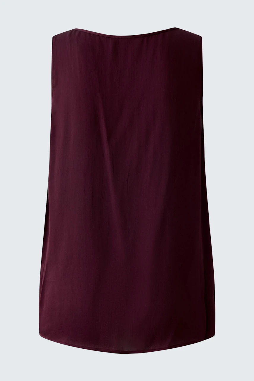 Casual women's top: A simple maroon sleeveless top with a relaxed fit, perfect for everyday wear.