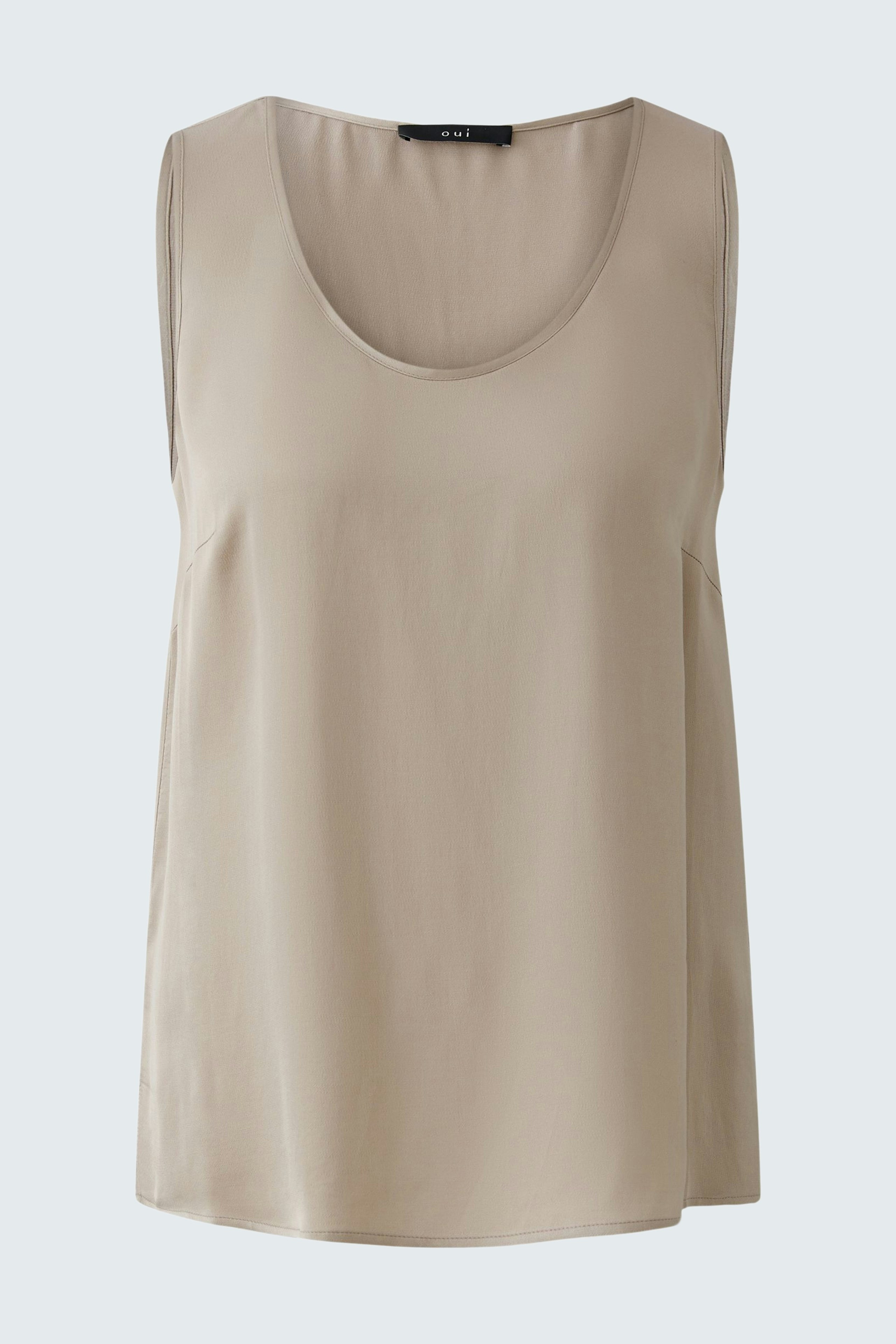 Casual women's top: A light beige sleeveless top with a relaxed fit, perfect for warm days.
