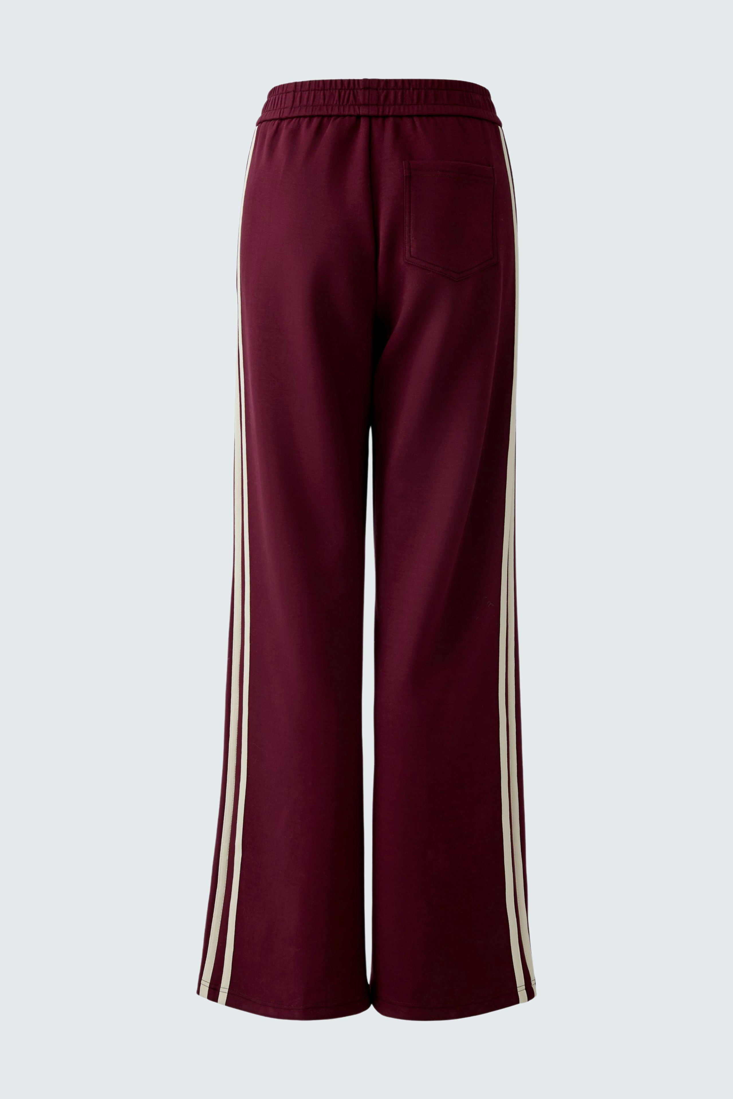 Comfortable women's joggers in burgundy with side stripes, perfect for casual wear.