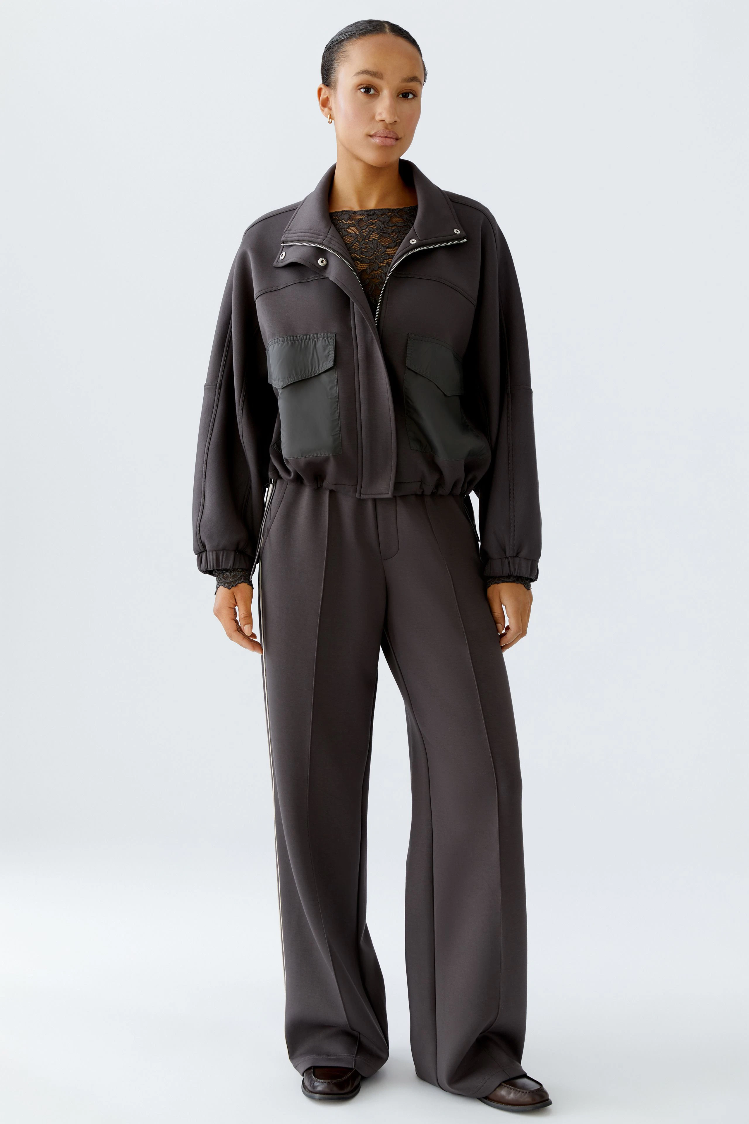 Comfortable women's joggers in dark gray with a relaxed fit and elastic waistband.