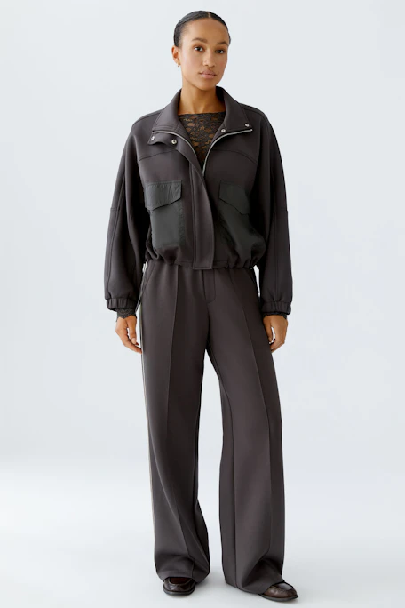 Comfortable women's joggers in dark gray with a relaxed fit and elastic waistband.